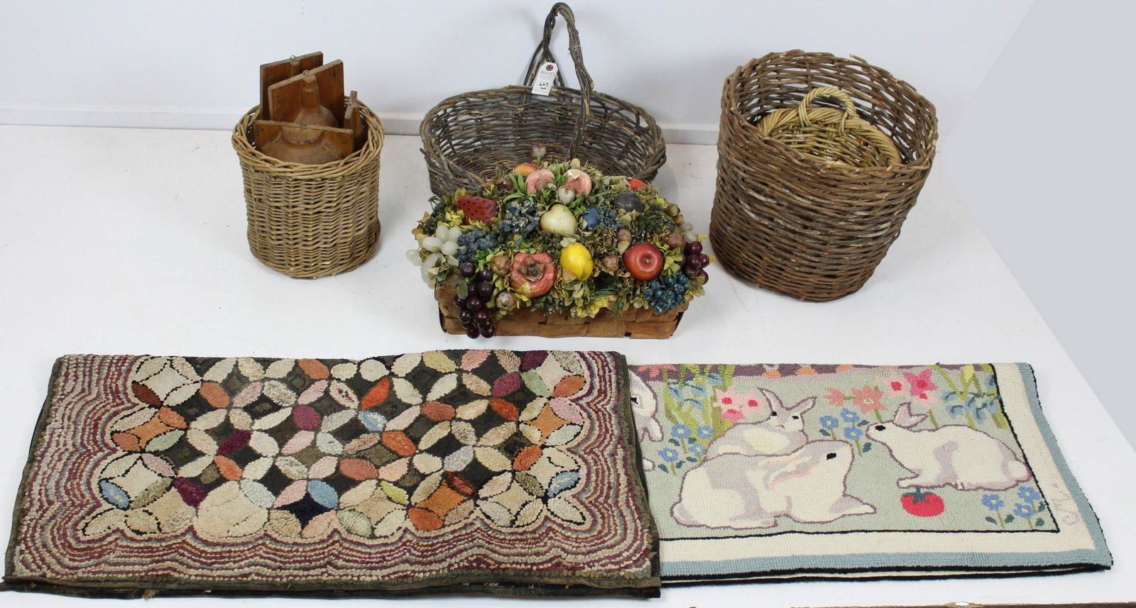 Hooked Rugs, Wax Fruit Arrangement, Baskets: Estate lot of country accessories including wooden bottle pattern molds 2 hooked rugs (one contemporary, one vintage), wax fruit and dried floral arrangement, assorted willow baskets