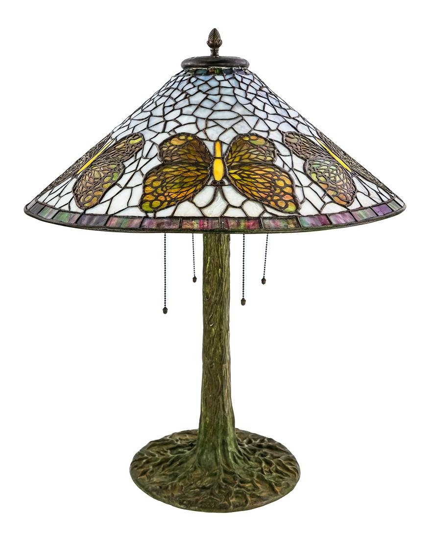 Riviere Studios Leaded Glass and Bronze Table Lamp: Riviere Studios leaded glass & bronze "Butterfly" table lamp, 4 light cast bronze base, a few cracked pcs of glass, some resoldering to shade, shade diameter 24", overall ht 29"