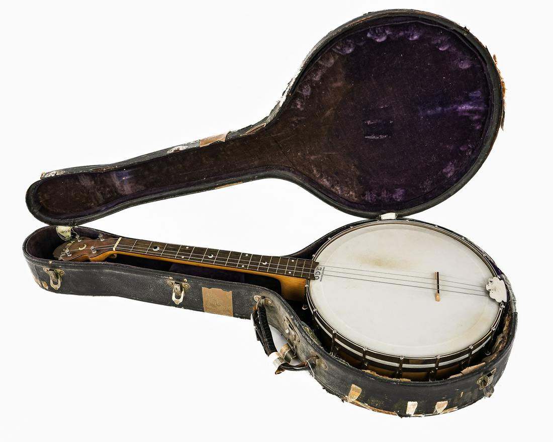 Early 20th C Regina Tenor Banjo: Early 20th c Regina Tenor Banjo with mother of pearl crescent inlays. Replaced head and bridge, Action appears decent, comes in OHSC (case rough.) 31" long body 12" diameter