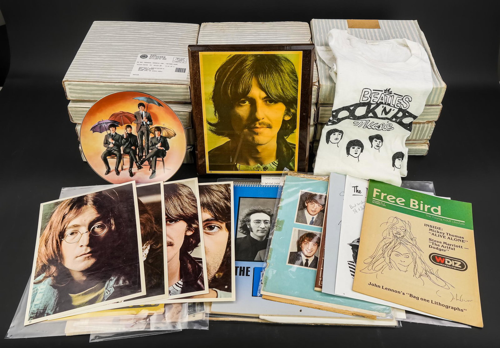 Beatles Collector Plates, Misc Beatles Swag: Beatles collector plates (13 pcs, 12 in original boxes) sold with a t-shirt, wooden plaque with George Harrison, color photos of the fab four, and a Beatles 100% cotton Rock 'n' Roll t-shirt (size lar