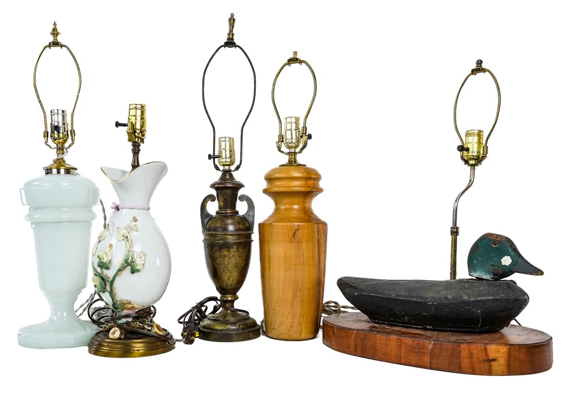 Lot of Assorted Vintage Lighting: Lot of assorted vintage lighting including opaque white bristol glass table lamp, ivy decorated porcelain vase lamp, spalted maple turned wooden lamp, duck decoy table lamp, and bronze 'trophy' form t