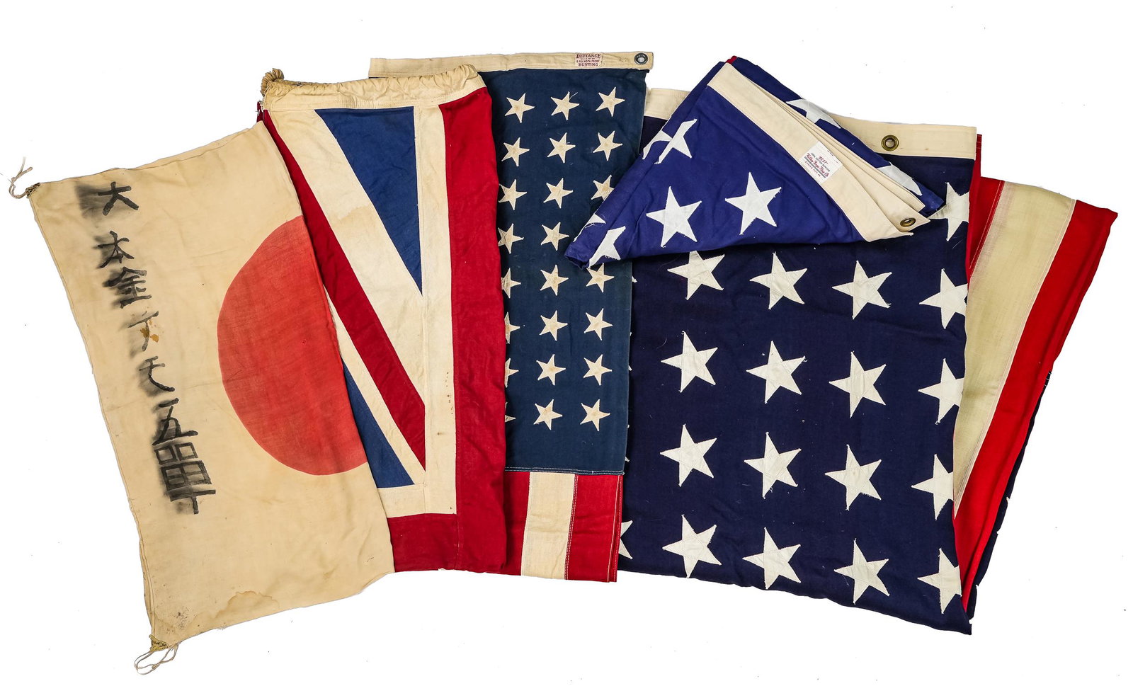 Group of Antique Flags: Group of flags, includes WWII captured Japanese Convoy Flag; signed 1st Sgt Bill Andersen, Union Jack, two 48-star American flags and one 50 star American flag. 30"x 32", 56.5"x26", 31.5"x56", 58.5"x1