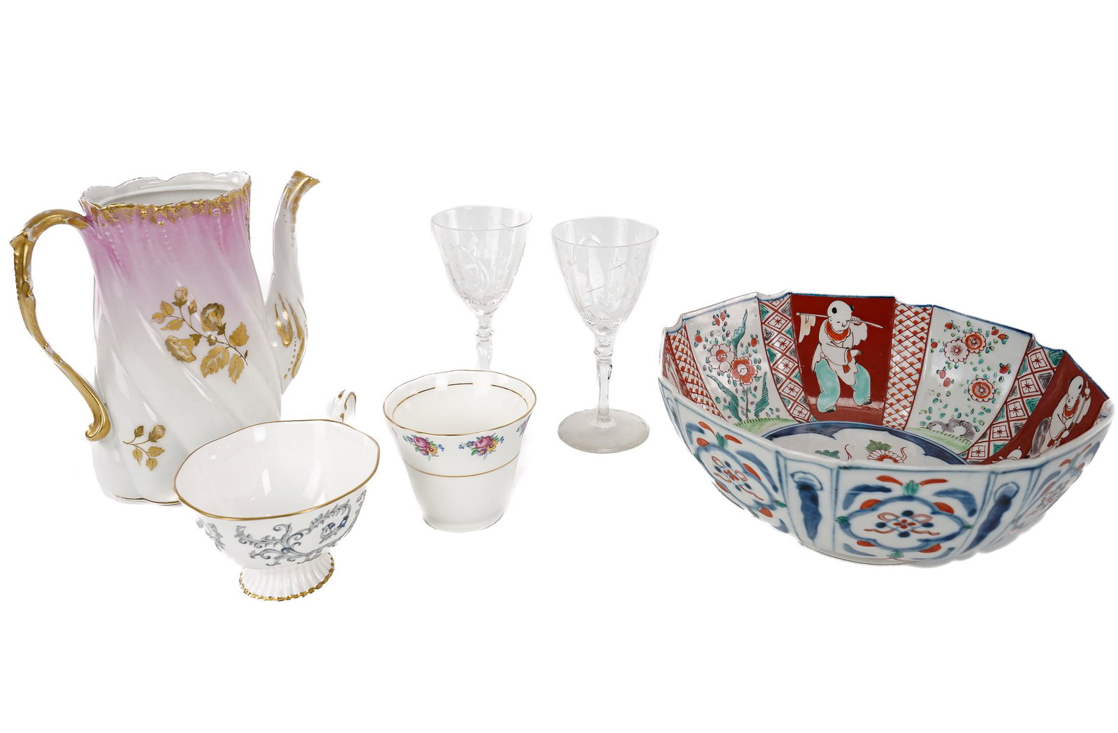 Large Lot of Porcelain and Glass Stemware: Large lot of vintage porcelain and glassware including a collection of English bone china cups and saucers, Japanese Imari bowl, Paris porcelain gold rim pot de creme set, Limoges porcelain items, Dep