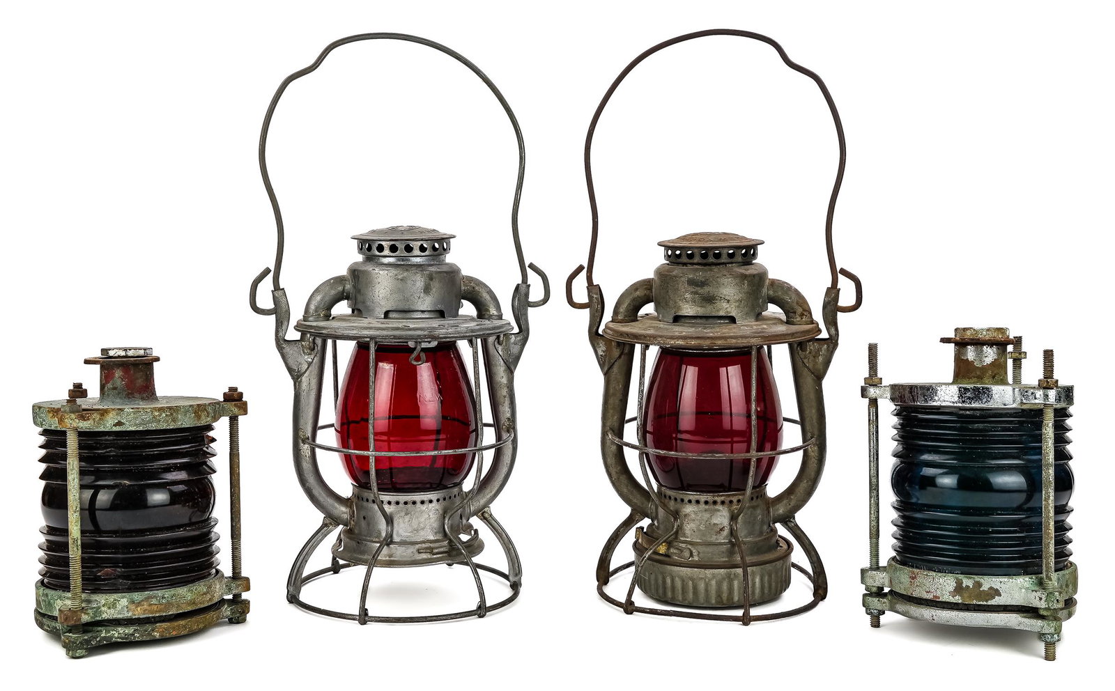Group of Railroad and Ships Lanterns: Group of 4 lanterns including a New York Central System Dietz Vesta RR lantern with red globe, and another Dietz Vesta unmarked RR lantern, accompanied by a pair of nautical ships' or boat signal lant