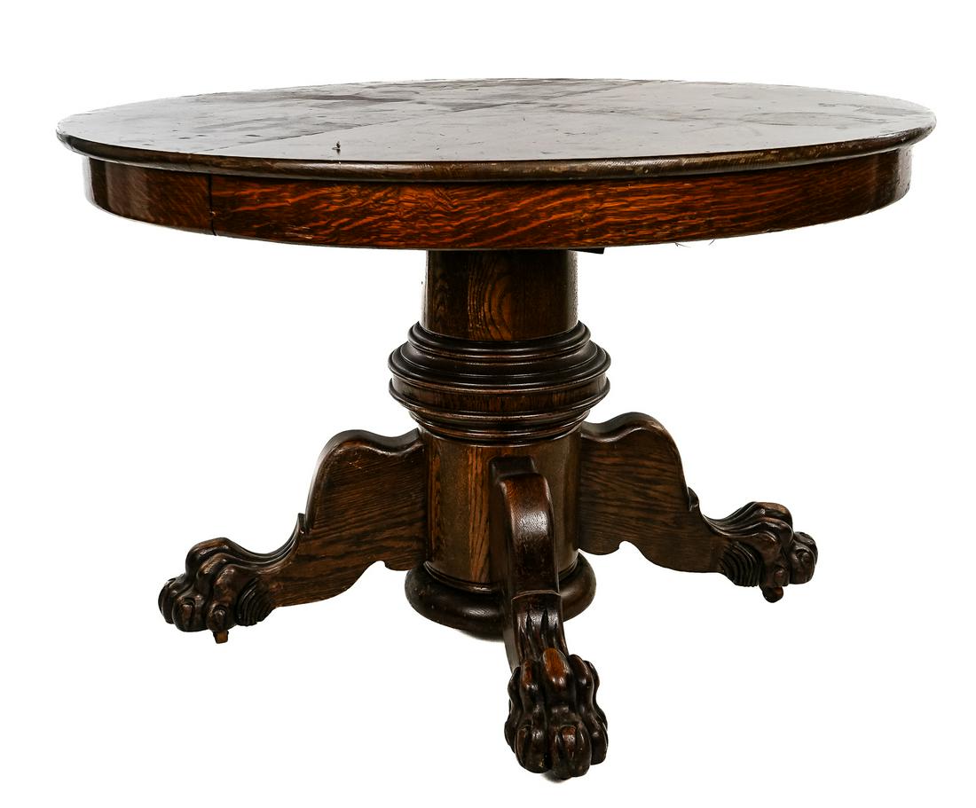 Victorian Oak Pedestal Dining table with four chairs: Victorian oak pedestal base dining table with hairy paw feet, 6- 10" leaves- sold with four T-back chairs (leather upholstery as found). 44" diameter