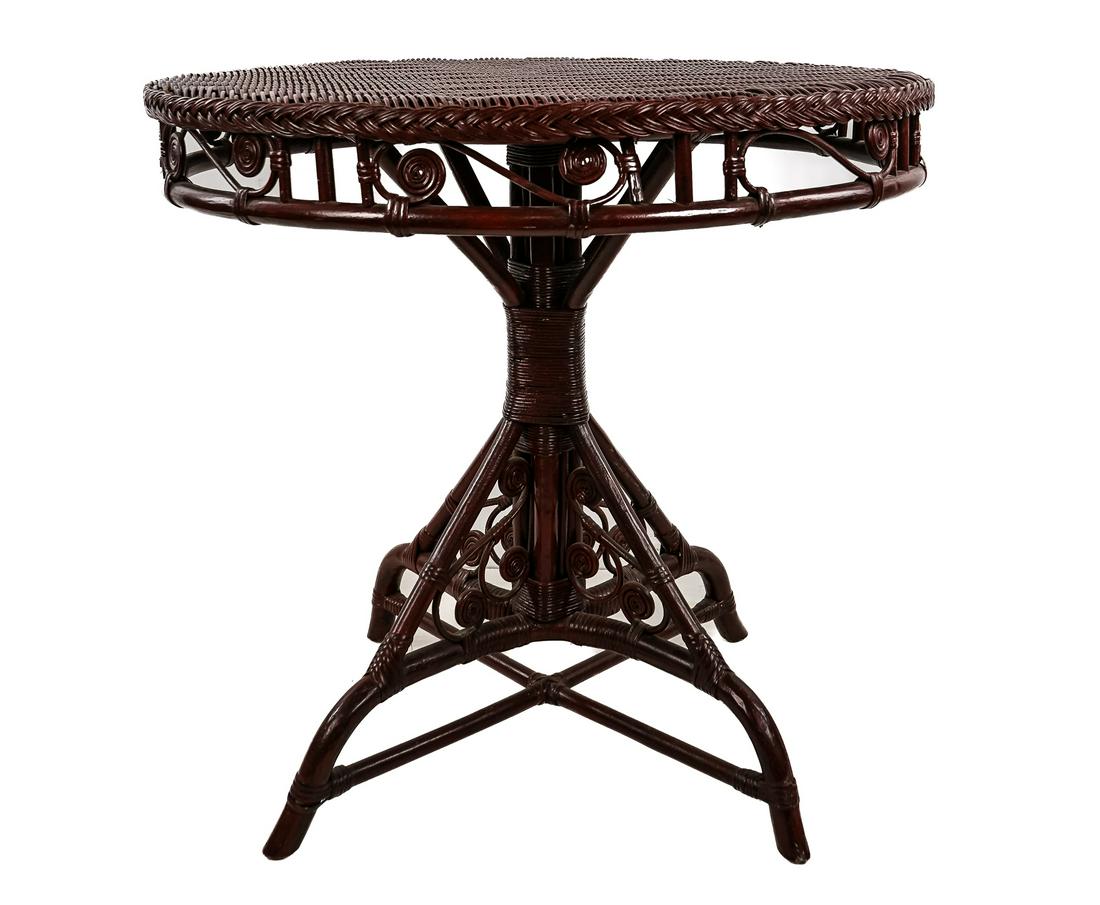 Henry Link Smithsonian Collection Wicker Table: Henry Link Smithsonian Collection brass labeled round wicker pedestal base parlor table with curlicue decoration, in antique red finish 28.5" x 30"