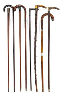 8 Sterling Mounted Walking Stick Canes: Collection of 8 Edwardian era gents or ladies walking stick canes, each having some for of sterling silver cap or mountings, two with stag horn handles, ht. 35"-36.5"