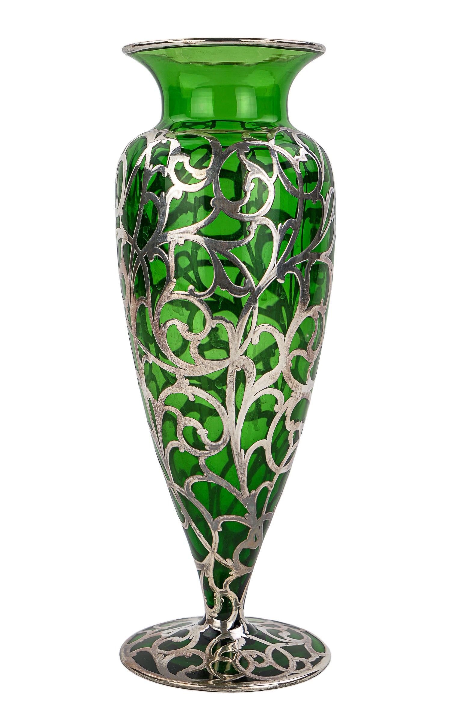 Sterling Overlay Emerald Glass Footed Vase: Fine ca. 1900 late Victorian/Edwardian era sterling silver overlay emerald green glass vase with flared rim and footed base, center cartouche with no monogram, scrolling motif decoration, overall very