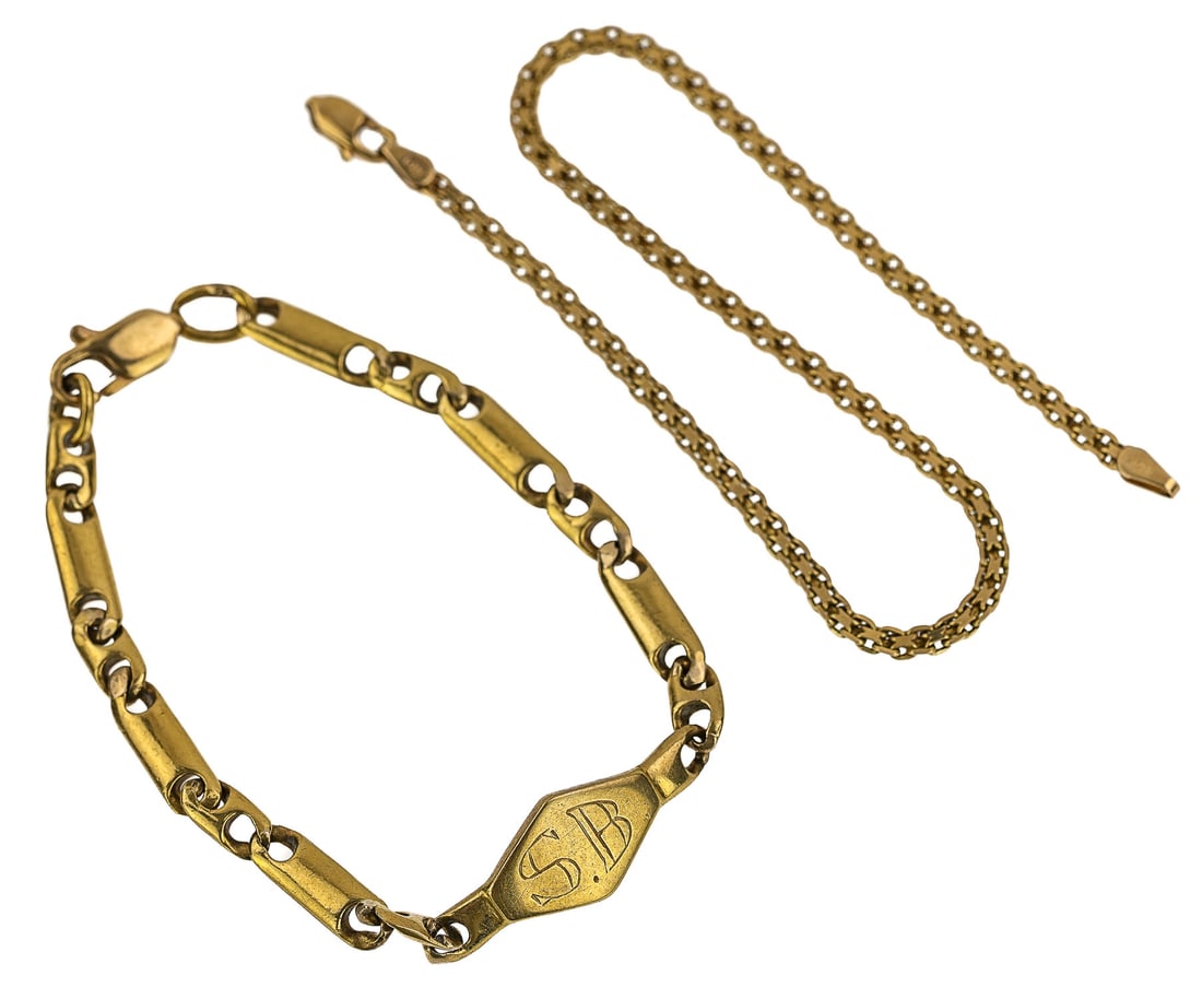 Two 14k Gold Chain Bracelets: Two gold chain bracelets including a heavy link and a chain. 18.8 grams. T.w.