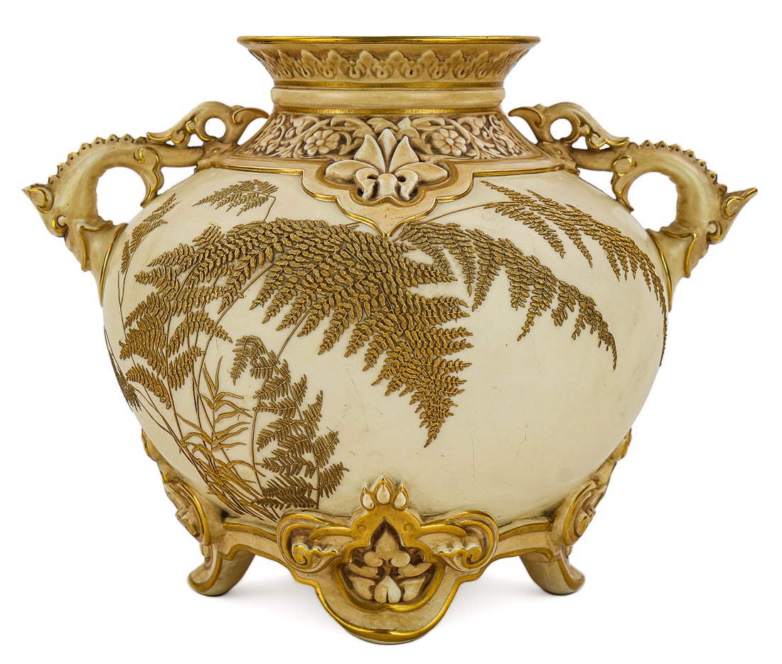 Royal Worcester Persian Style Fern Vase: Fine Royal Worcester bone china porcelain Persian style vase having raised gilt enamel fern decoration, stylized dolphin form handles on footed base 9.5" x 12" -chip to one handle finial