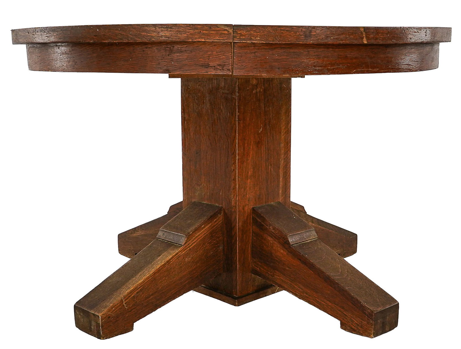 Oak Arts and Crafts Style Dining Table: Oak Arts and Crafts style dining table in mellowed natural finish, extends for leaves (Not Present) missing casters 29 x 46" diameter.
