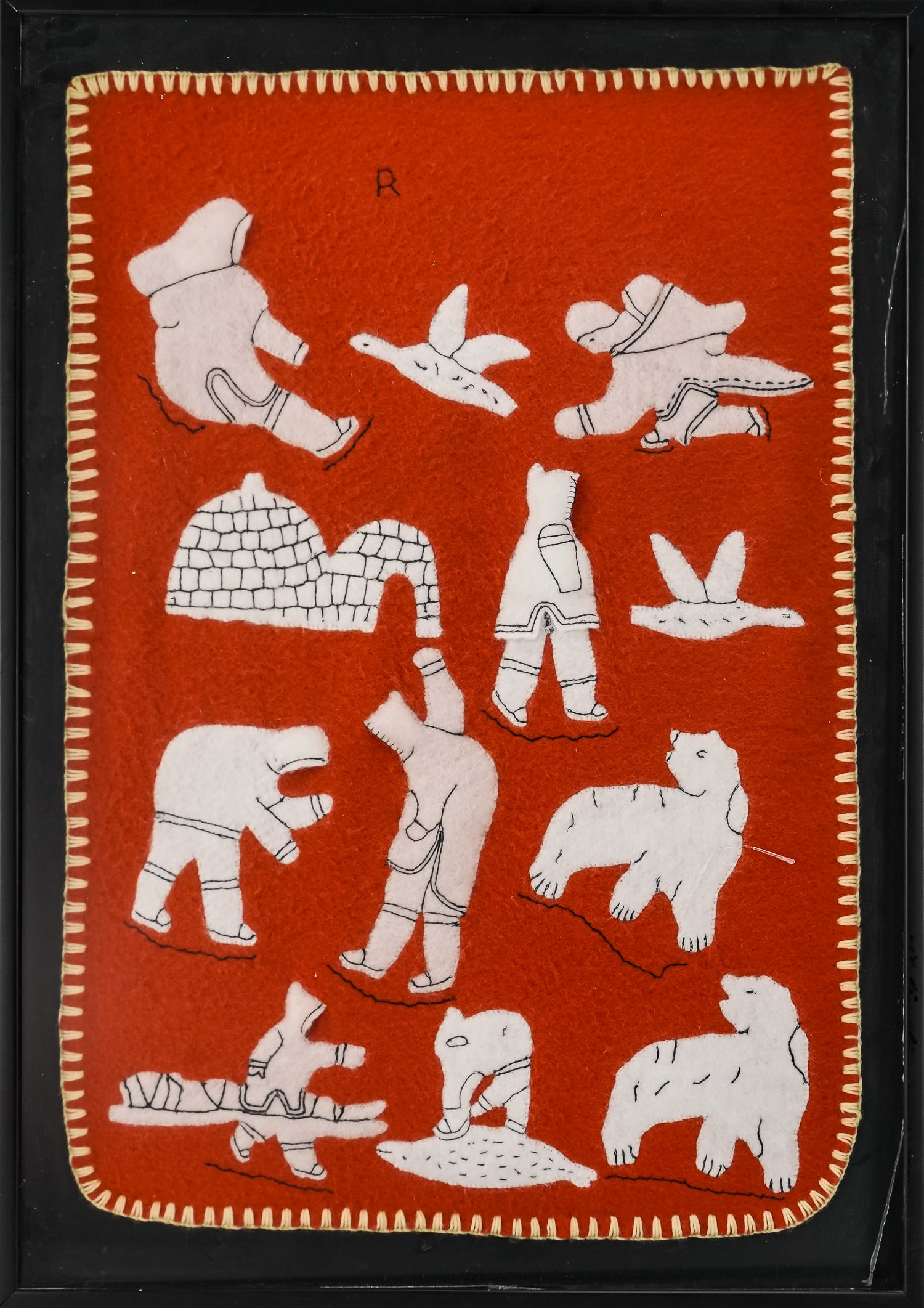 Inuit Pictorial Wool Hand Stitched Picture: Inuit wool pictorial hand-stitched picture depicting scenes of hunting and fishing in the arctic, signed R, framed, sight 28" x 19"