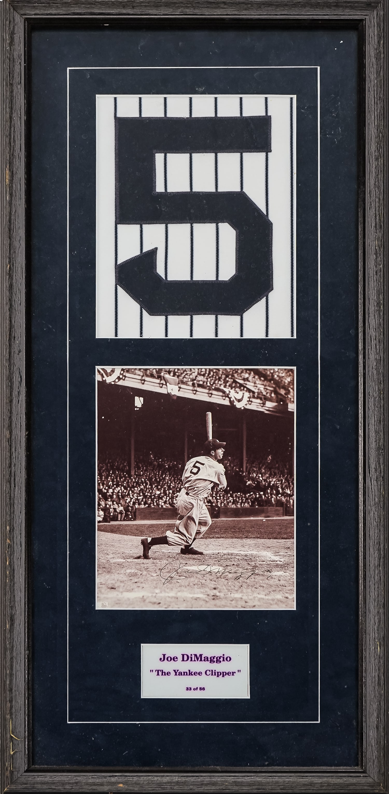 Joe DiMaggio Autographed Photograph: Framed archive of New York Yankee Joe DiMaggio, includes vintage 8" x 10" black and white photo signed, number 5 pinstripes, and title Joe DiMaggio "The Yankee Clipper" 33 of 56. 15" x 32" framed.
