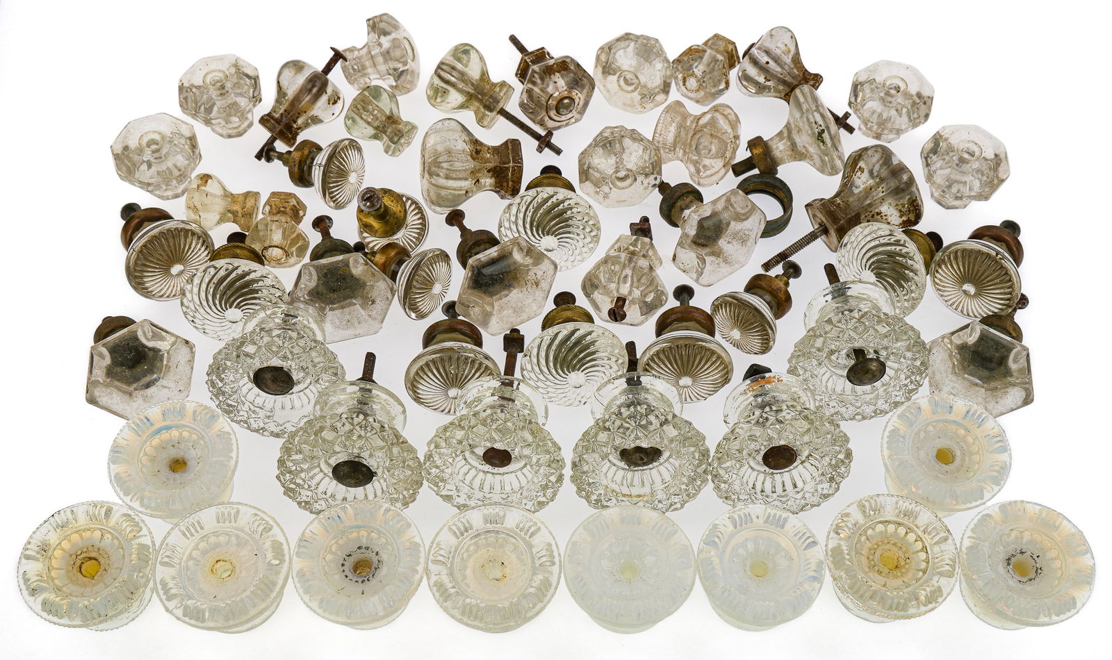 19th and 20th c. Glass Furniture Knobs: Collection of 19th and early 20th c. glass furniture knobs including set of 10 matching Sandwich opalescent knobs, 6 clear Sandwich type knobs, brass mounted swirl, faceted, etc.