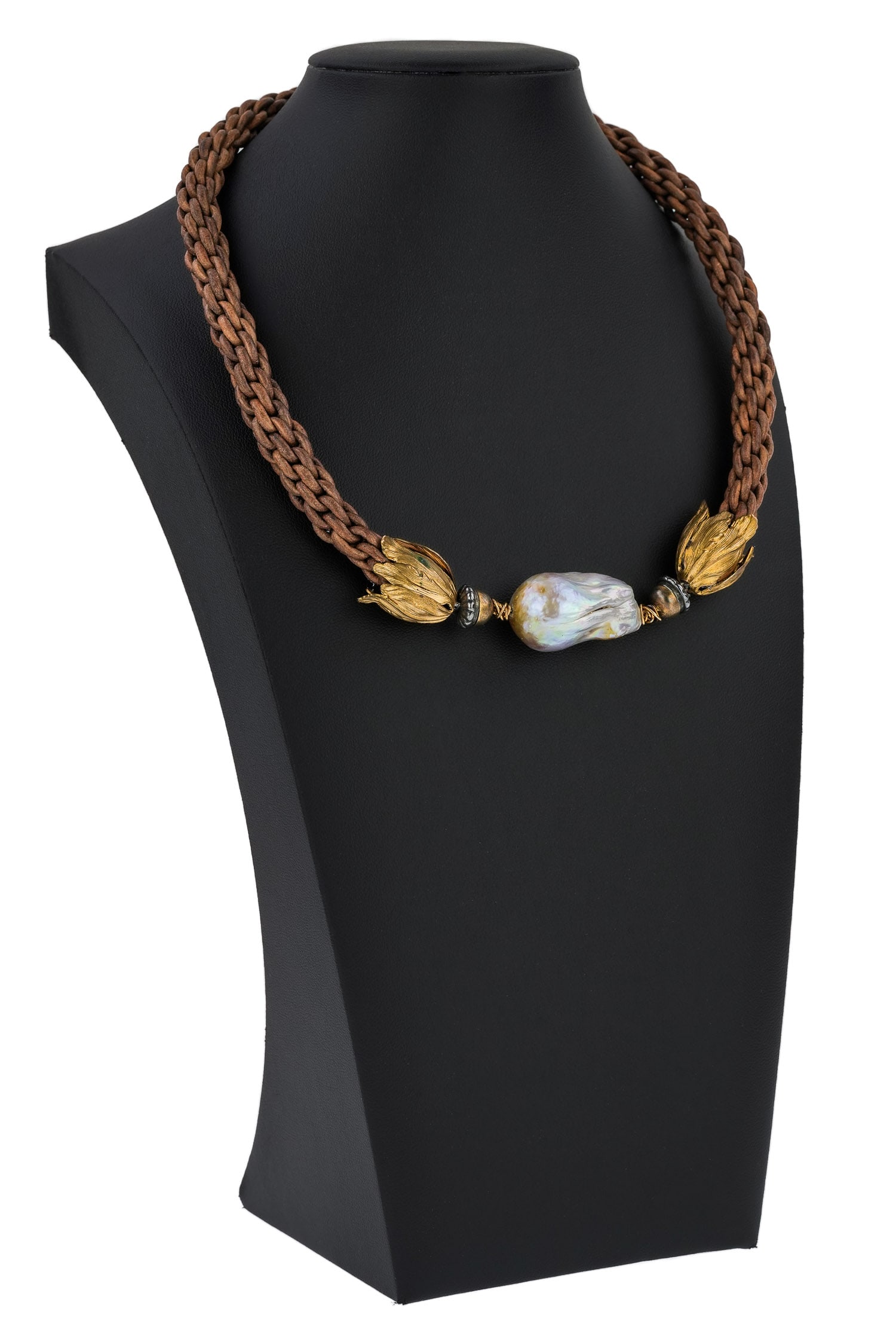 Baroque Pearl Leather & Gold Choker: Woven leather chocker necklace with gold foliate ends, silver acorns, and magnet clasp joining a 1 3/8" long baroque pearl. 18" long.