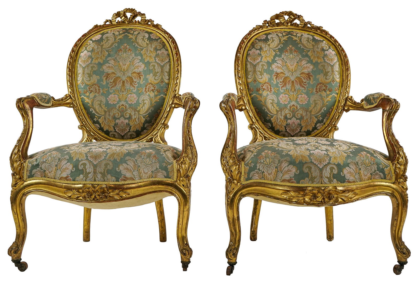 Pair of 19th c French Gilt Armchairs: Pair of mid 19th c French gilt gessoed fauteuil armchairs in a later Jacquard upholstery with ribbon carved crest. 40 x 26 x 21"