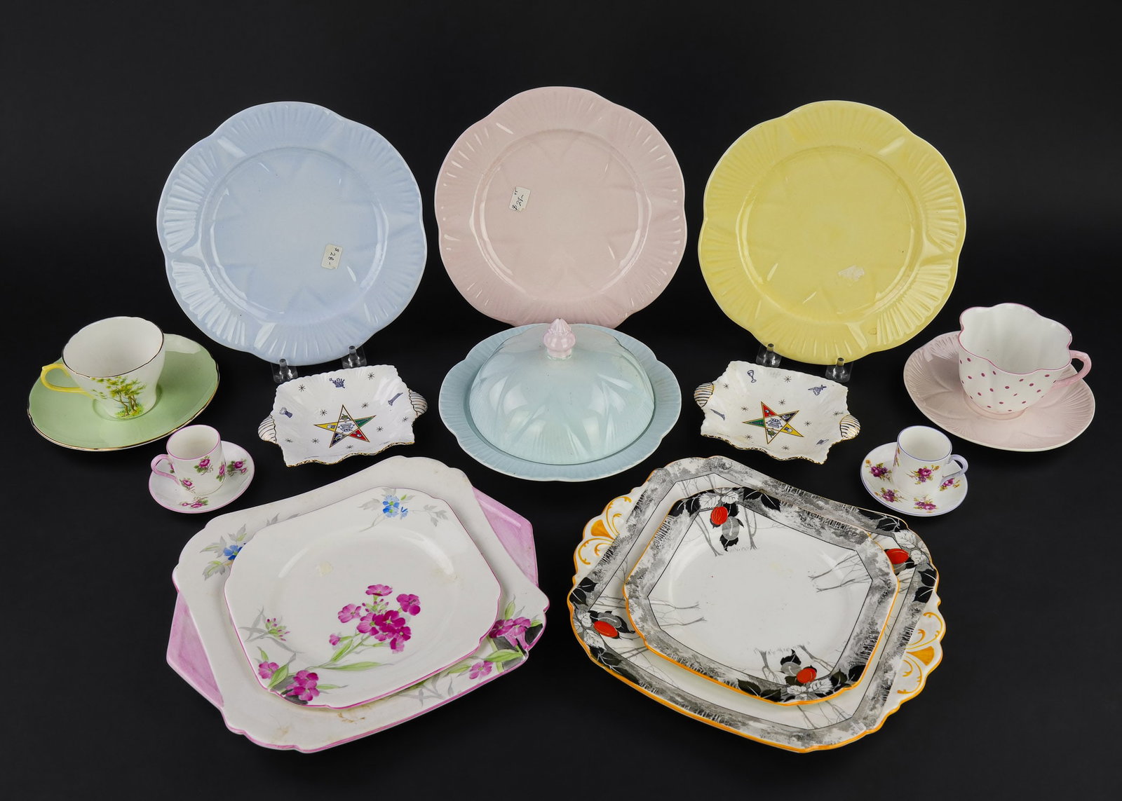 Collection of Shelley Bone China Tableware: Large assortment of Shelley fine English bone china porcelain tableware items including 3 Art Deco era dessert sets, cake plates, 4 pc. tea set, sugar and creamer set, 4 miniature cups, pastel dessert