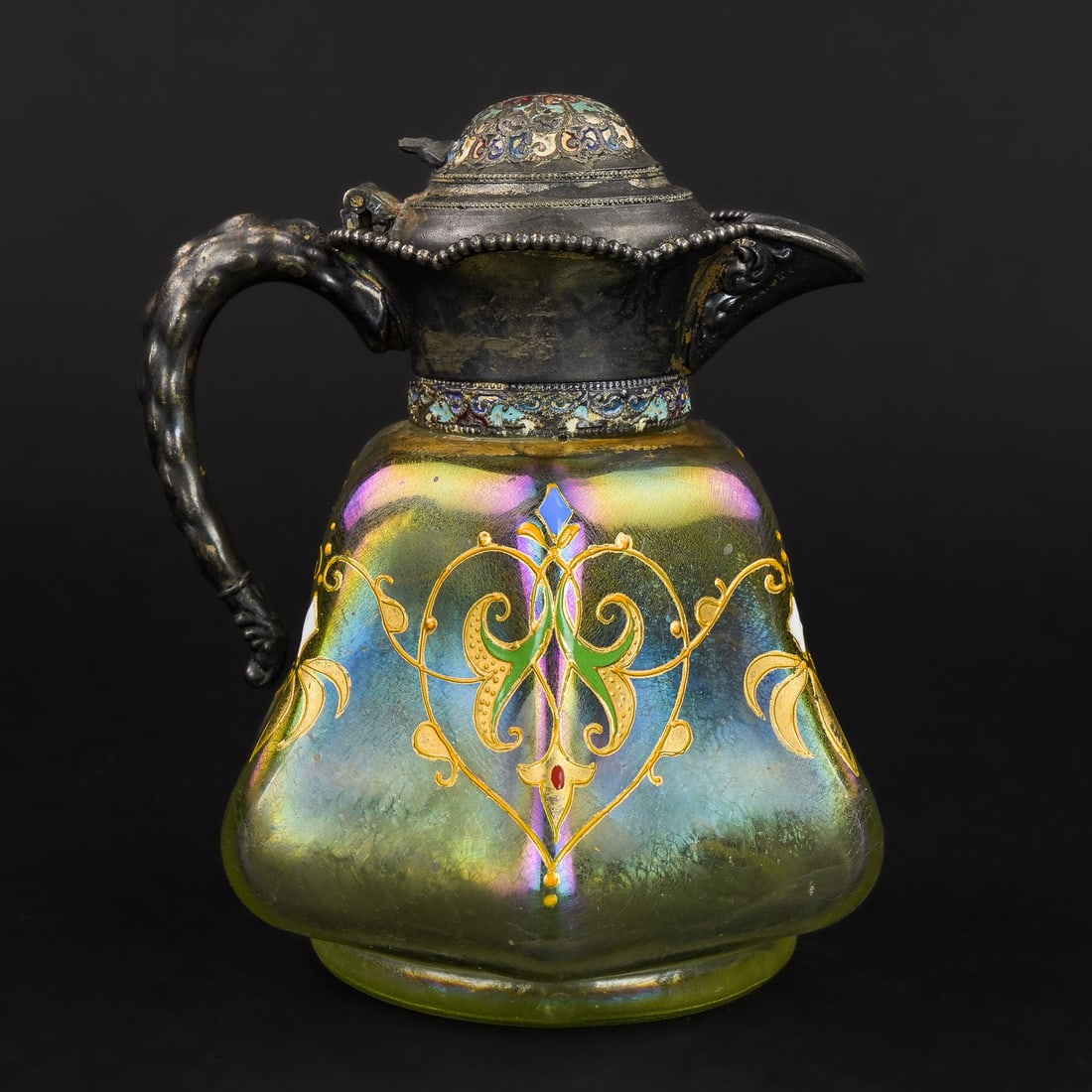 Austrian Loetz Enamel Decorated Syrup Pitcher: Fine 19th c light green enamel decorated Austrian / Loetz syrup pitcher with silver plated top having champlevé decoration. 5" h.