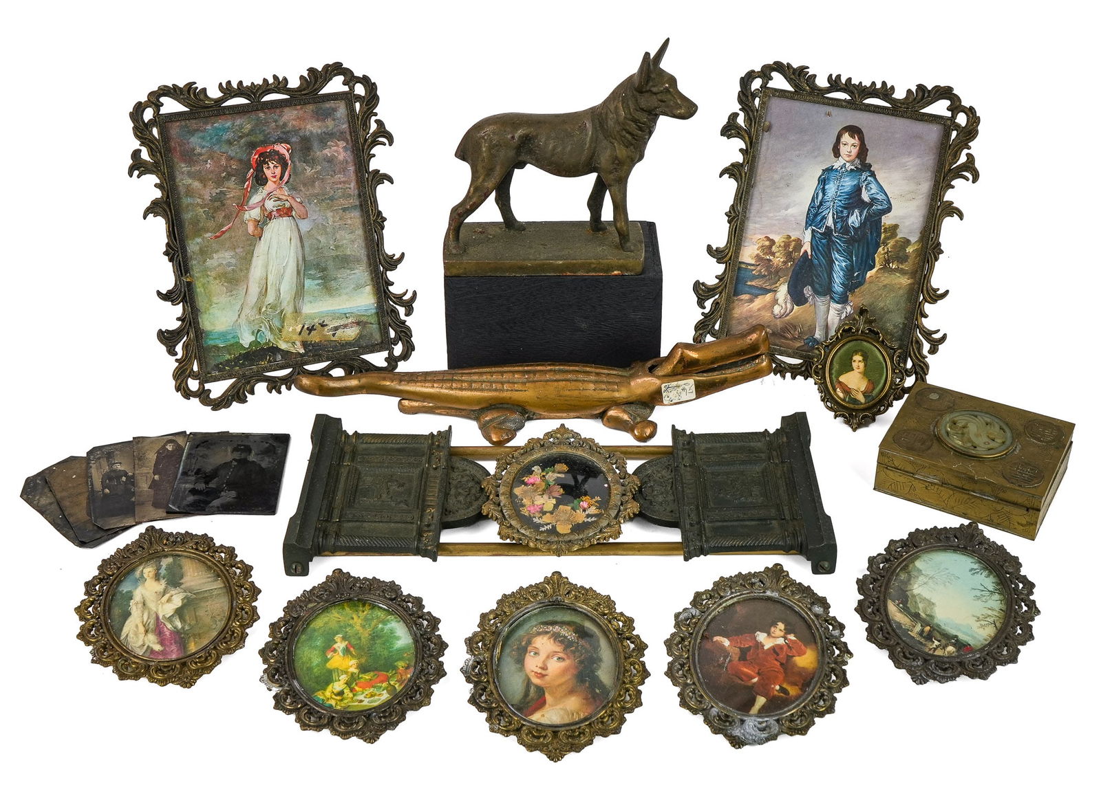 Brass Decorative Items, Civil War Ambrotype, etc: Lot of decorative metalware items including figural bronze alligator nutcracker, bronze German shepherd figure, small rococo style picture frames, ca. 1910 patinated metal adjustable book rack, Civil