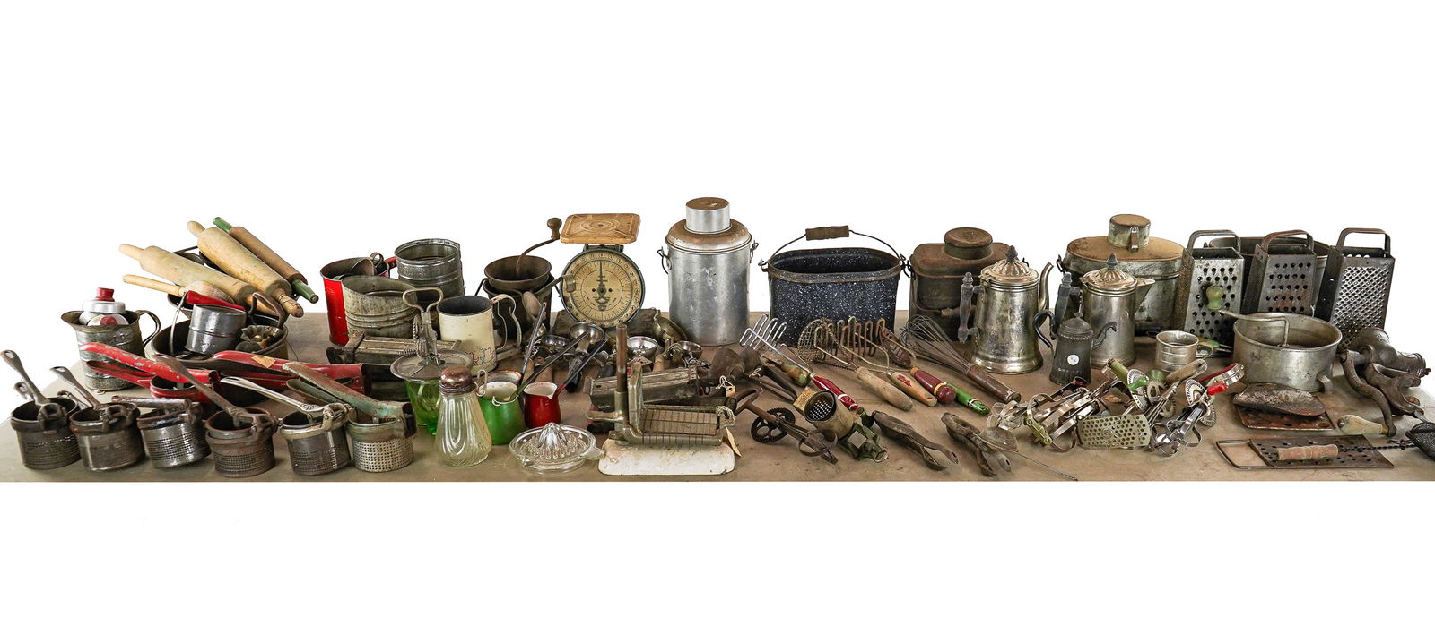 Large Lot of Vintage Kitchenware and Tin: Large lot of assorted vintage kitchenware and tin including egg beater with matching green depression glass bowl, early cone form ice cream scoops, potato ricers, graters, scale, coffee pots, egg beat
