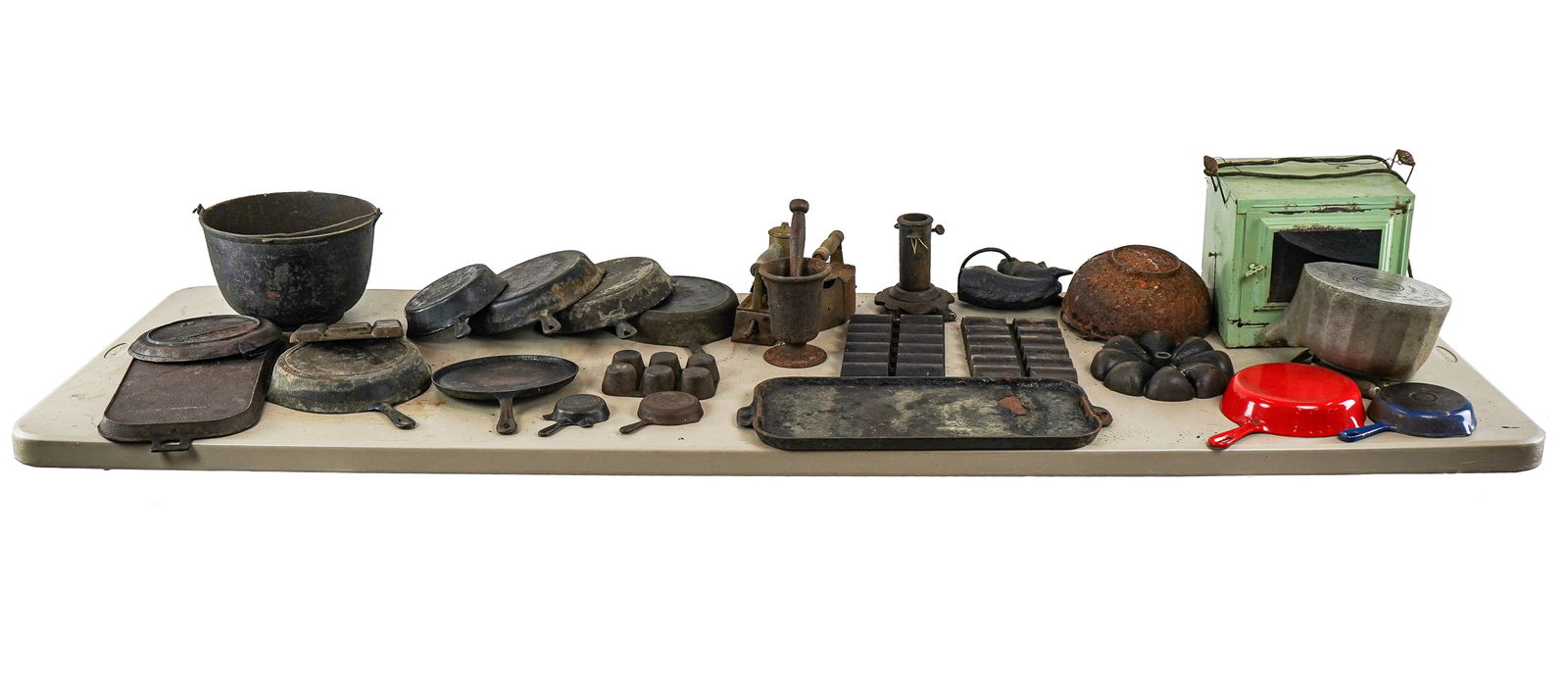 Large Lot of Vintage Kitchenware and Tin: Large lot of assorted vintage kitchenware and tin including egg beater with matching green depression glass bowl, early cone form ice cream scoops, potato ricers, graters, scale, coffee pots, egg beat