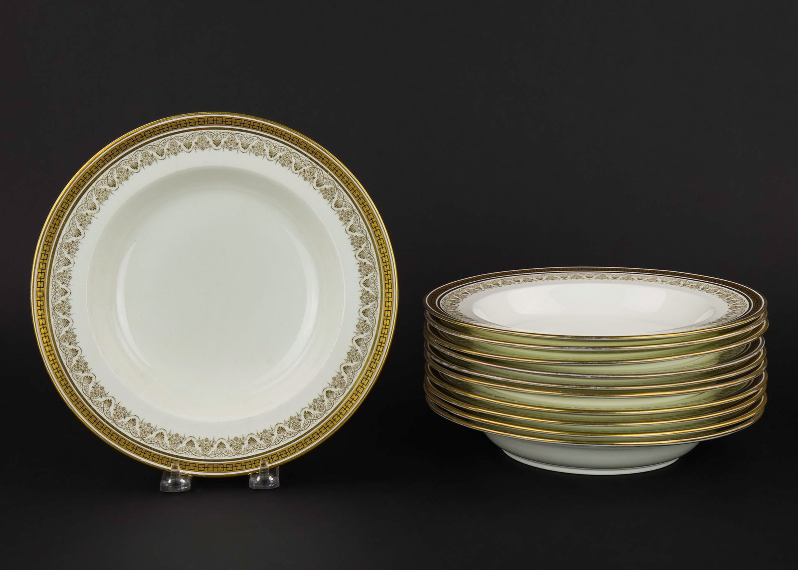11 Cauldon Gilt Grecian Motif Soup Bowls: Set of 11 ca. 1900 Cauldon English bone China soup bowls having gilt Grecian motif neoclassical borders, retailed by Plummer and Co. NYC, some wear commensurate with age and use dia. 9.5"