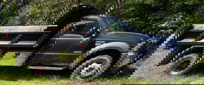 2006 Ford F550 super duty regular cab with dump bed, Plow, & Extra Tires