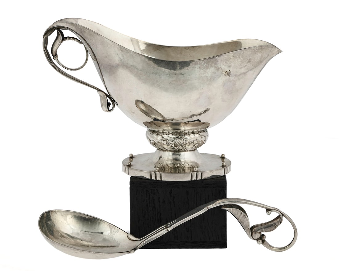 Georg Jensen MCM Sterling Sauce Boat and Ladle: Ca. 1935 Georg Jensen Denmark "Blossom" pattern Art Deco handwrought sterling silver footed gravy or sauce boat having foliate base, with matching openwork ladle designed by Johan Rohde 5" x 8", 8" x