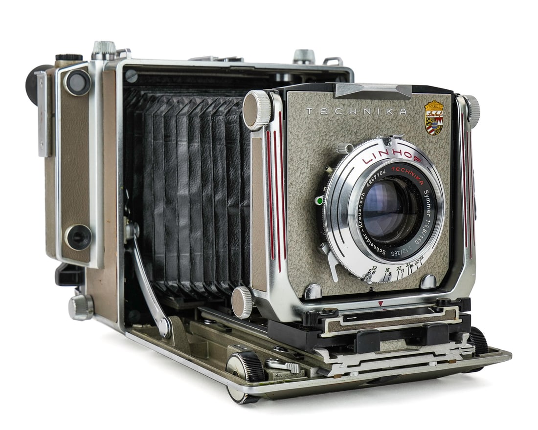 Linhoff Technika Camera w/ Accessories: Linhoff Technika plate camera with accessories, including Linhoff Rollex roll-film adapter, hand grip, automatic rangefinder, Cine Rollex back, 90mm, 150mm, 240mm lenses, 5 Linhof drop-in filters, fil