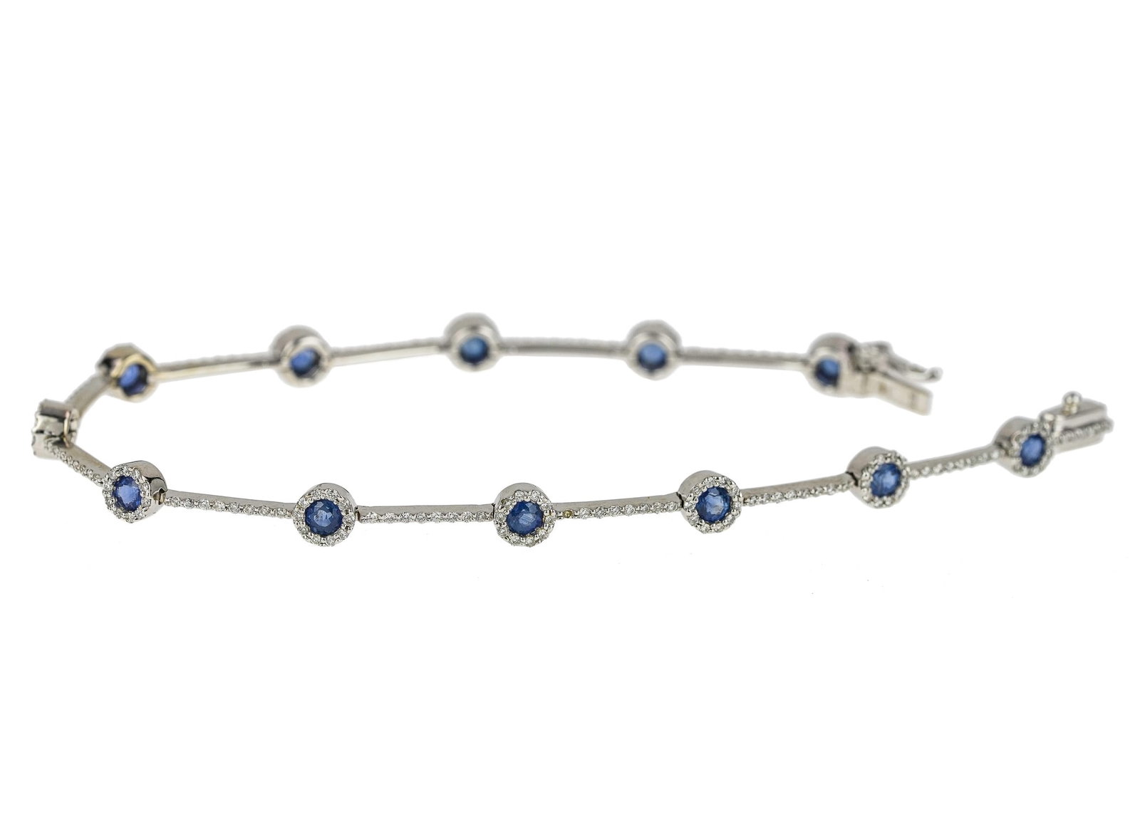 Sapphire, Diamond, & 14k Bracelet: Fine 14k white gold bracelet with 12 round cut 3 mm dia. Sapphires each set with a diamond surround and a hinged bar with diamonds. Approx. .75 cts t.w. diamonds. 7" long.