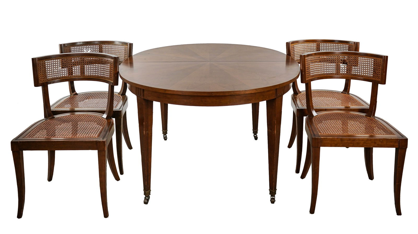 Baker Dining Room Table & 6 Chairs: Baker Furniture Co. mid-century fruit wood oval dining room extension table and a set of 6 cane seat side chairs (2 with breaks in caning in backs). Oval table 54" long, 45" wide, 29" h. Comes with 1
