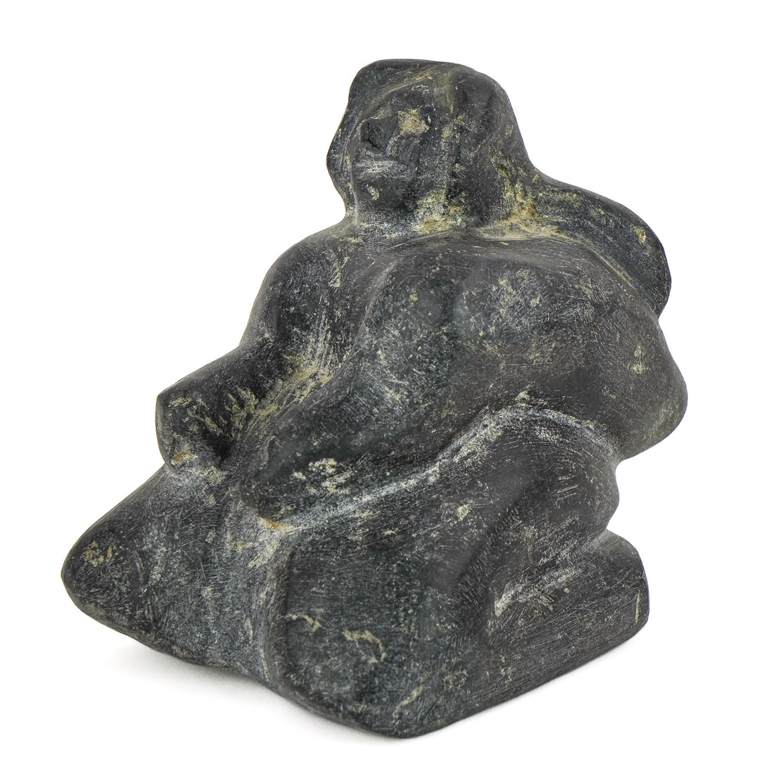 Inuit Carved Stone Kneeling Figure: Inuit carved stone kneeling figure, signed illegibly on base, ht 5 1/2", length 6"
