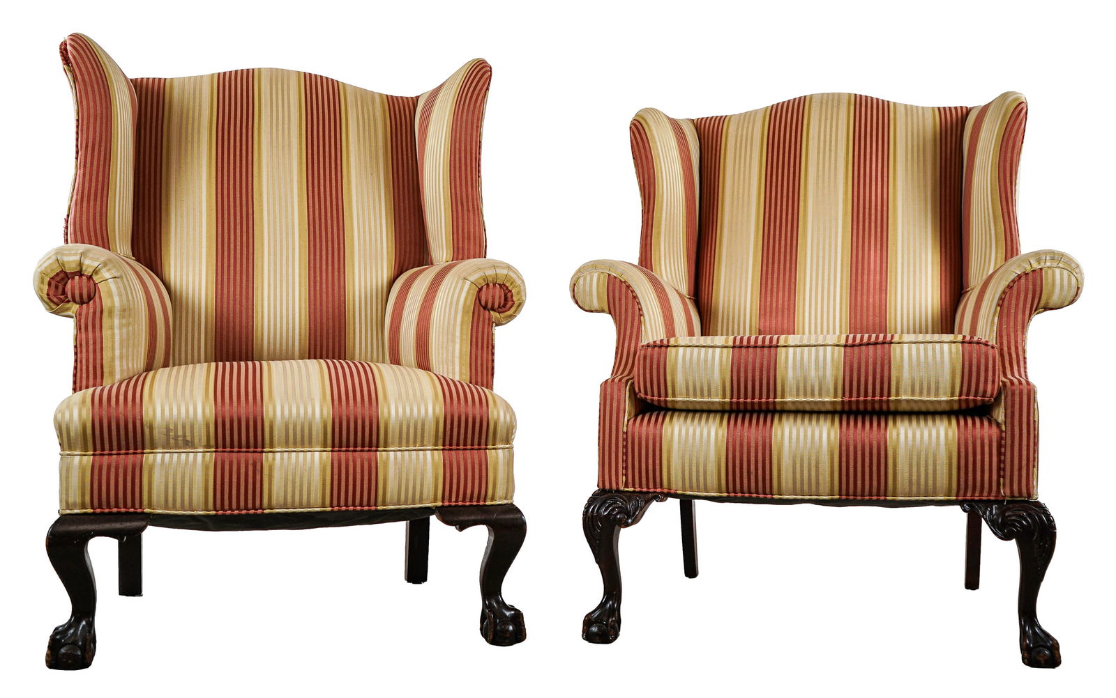 Pair of Chippendale Style Arm Chairs: Pair of 20th c Chippendale mahogany ball and claw foot wing chairs. Re-upholstered in a cream and red stripe fabric in good condition.