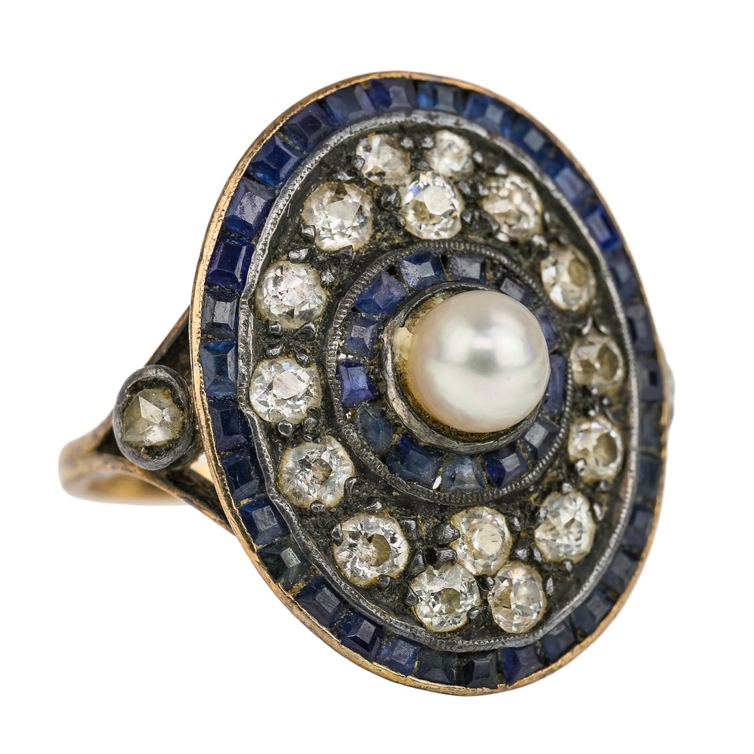 Old Mine Cut Diamond, Sapphire, Pearl & Gold Ring: 18th or early 19th c yellow gold ring with oval setting having a 5 mm center pearl, 13 small baguette channel set sapphires in silver, surrounded by 16 approx. .08 ct old mine cut diamonds in silver p