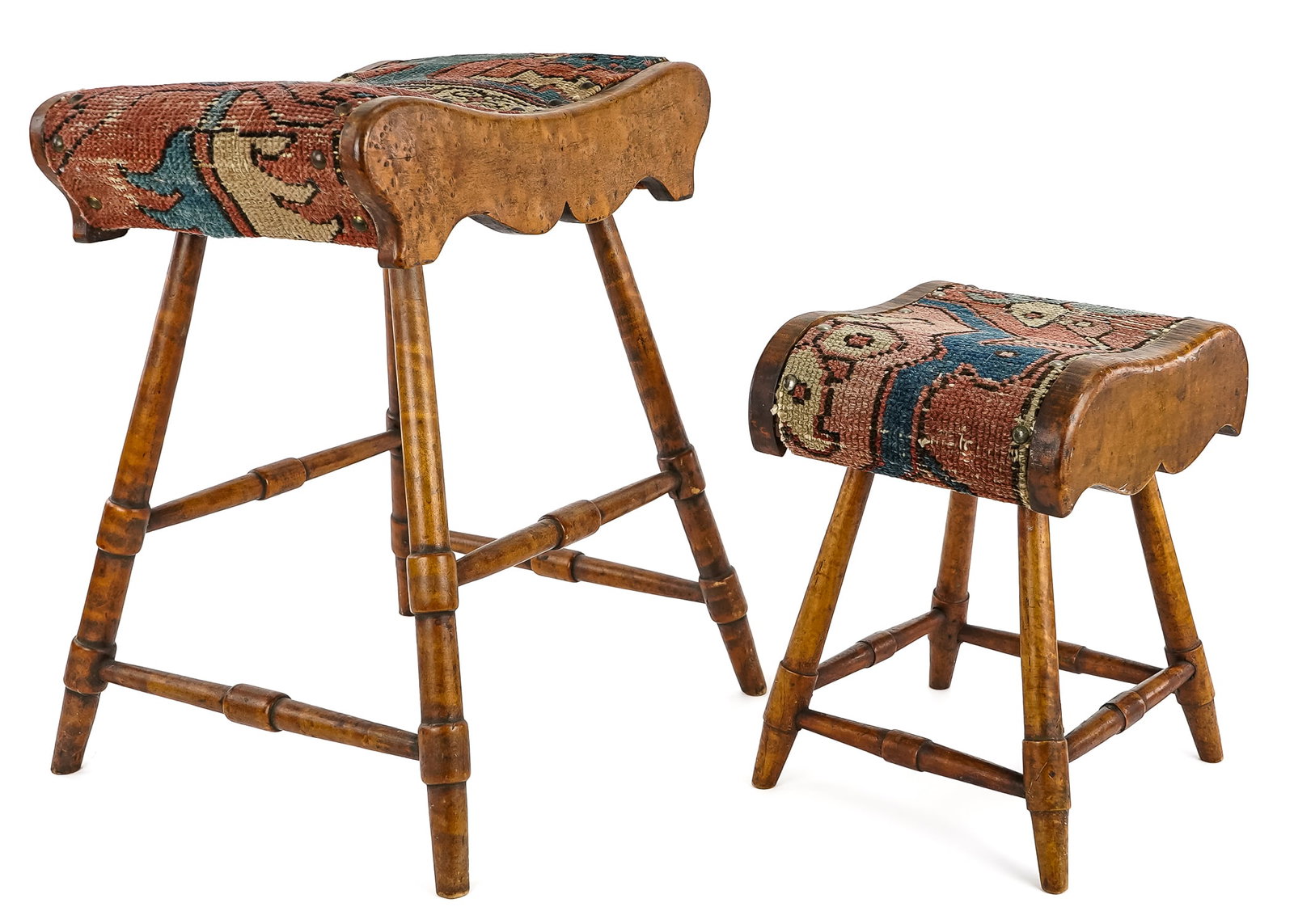 Two 19th c Figured Maple Footstools: Two matching figured maple footstools with splayed legs, Oriental carpeting, hts 18", 12" lengths 14 1/2", 10"