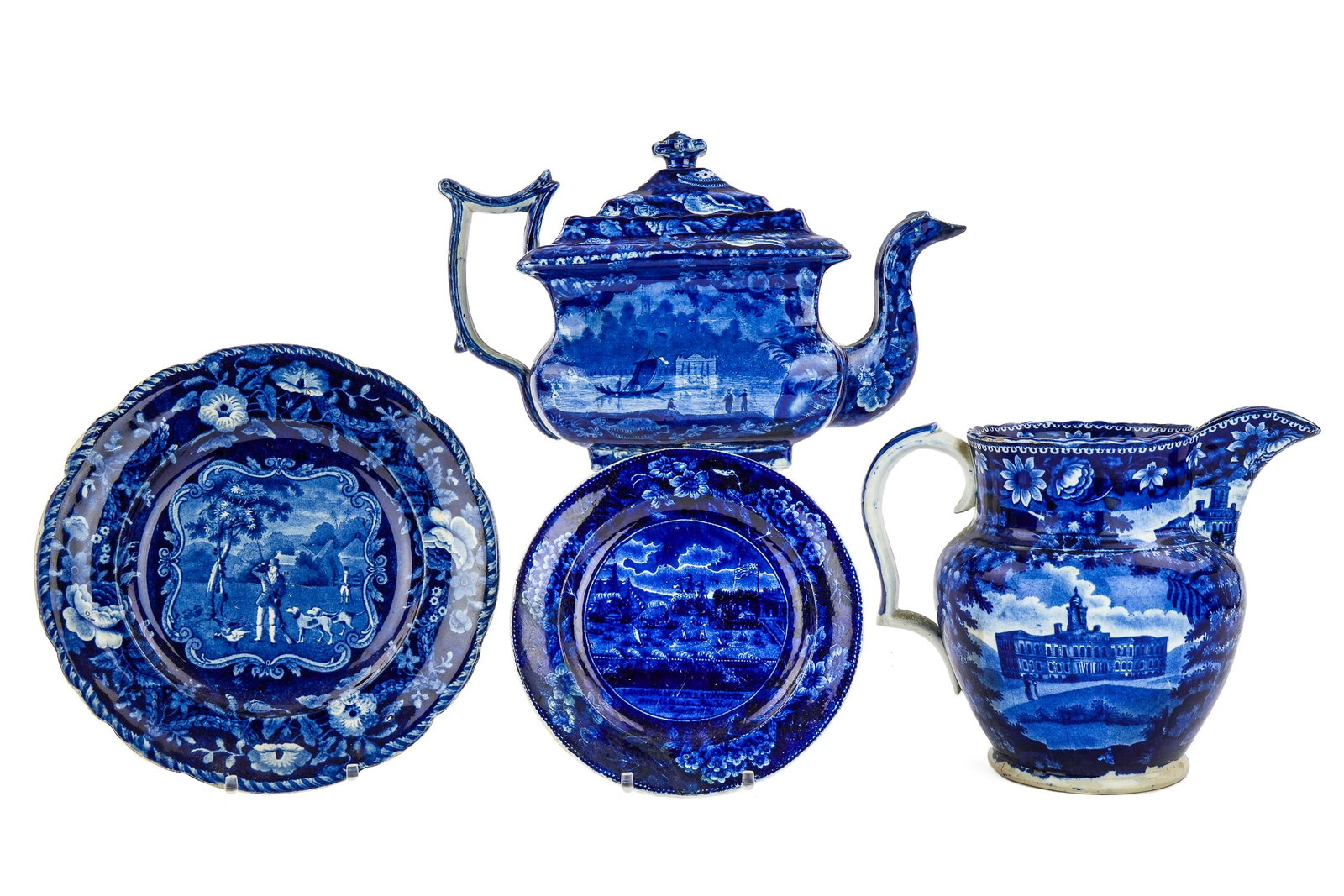 4 pcs. Staffordshire incl. Landing of Lafayette: 4 pcs. of 19th c. deep blue Staffordshire transferware soft paste porcelain including teapot with sailboat scenic panels (spout repaired), Clew's hunt scene plate, Landing of Lafayette at Castle Garde