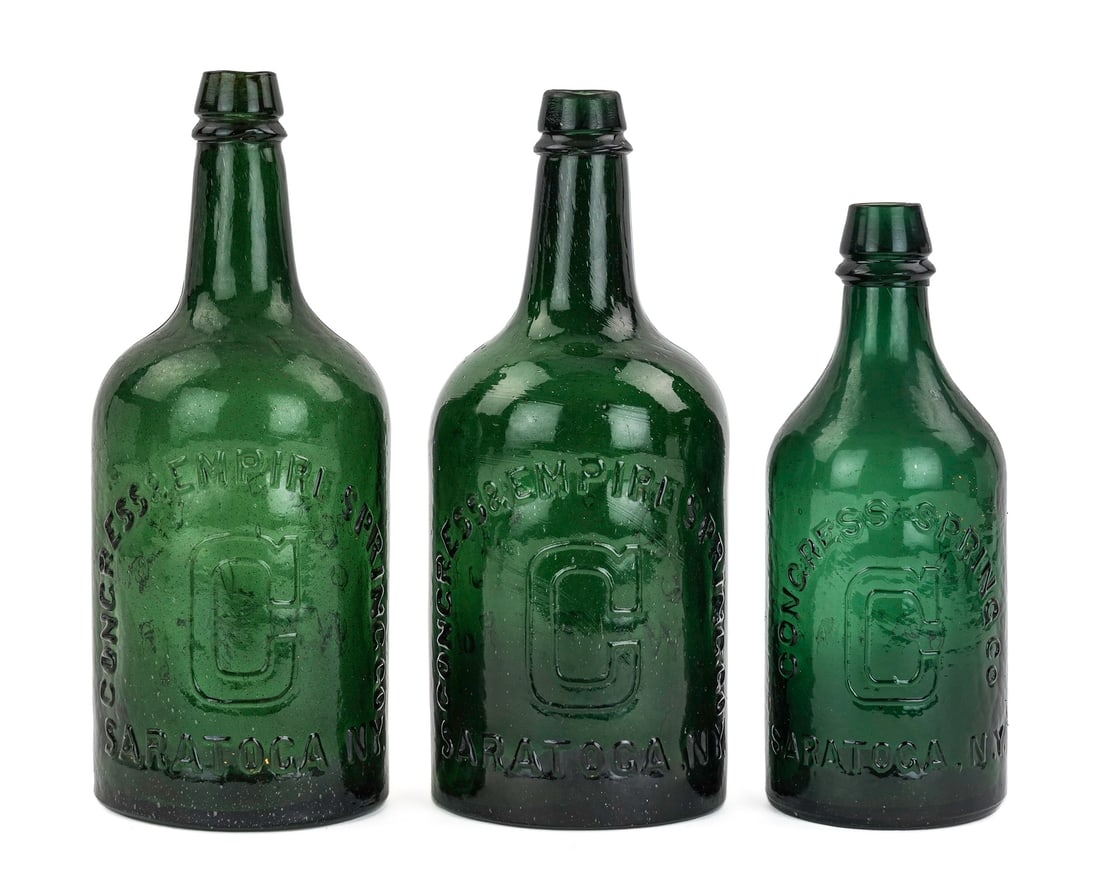 Late 19th c Saratoga Mineral Water Bottles: Three late 19th c Saratoga Congress, Congress & Empire Spring Co. bottles, including C spring pint (small nick on lip), C spring quart, darker teal green C spring quart, hts 7 3/4" to 9 1/4"