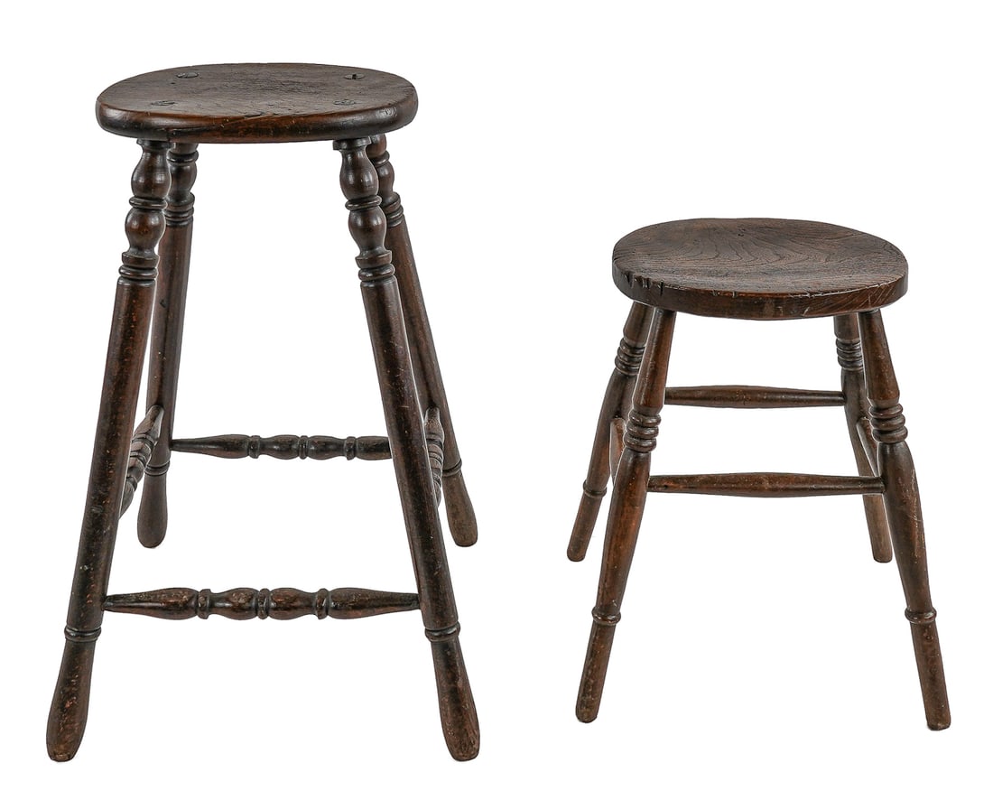 Two J Elliot & Sons English Windsor Stools: Two English Windsor stools, one signed J Elliot & Sons. 29" and 20" high. Elm, turned legs, and canted form.