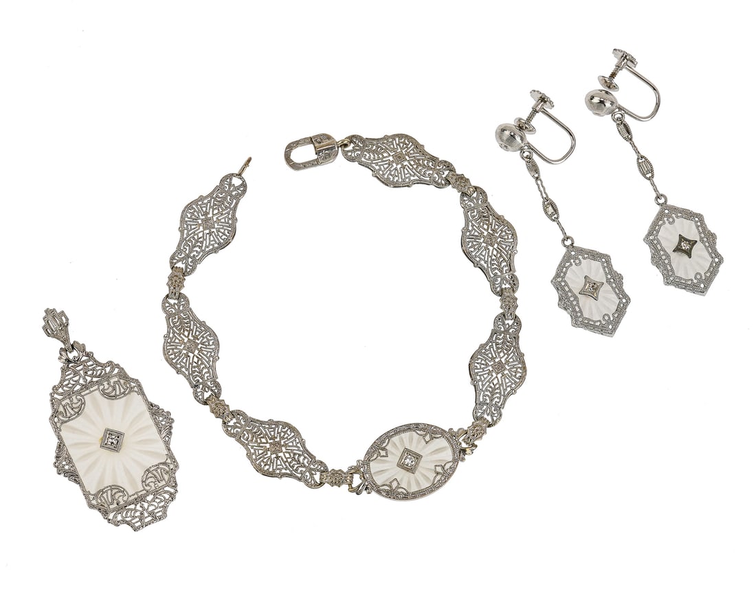 14k, Crystal, & Diamond, 4 Piece Set: Ca. 1900 ornate 14k white gold, crystal, & diamond 4 piece set including pendant, bracelet, and pair of earrings. Pendant 1 1/2" long with carved crystal under ornate white gold frame with center .04 