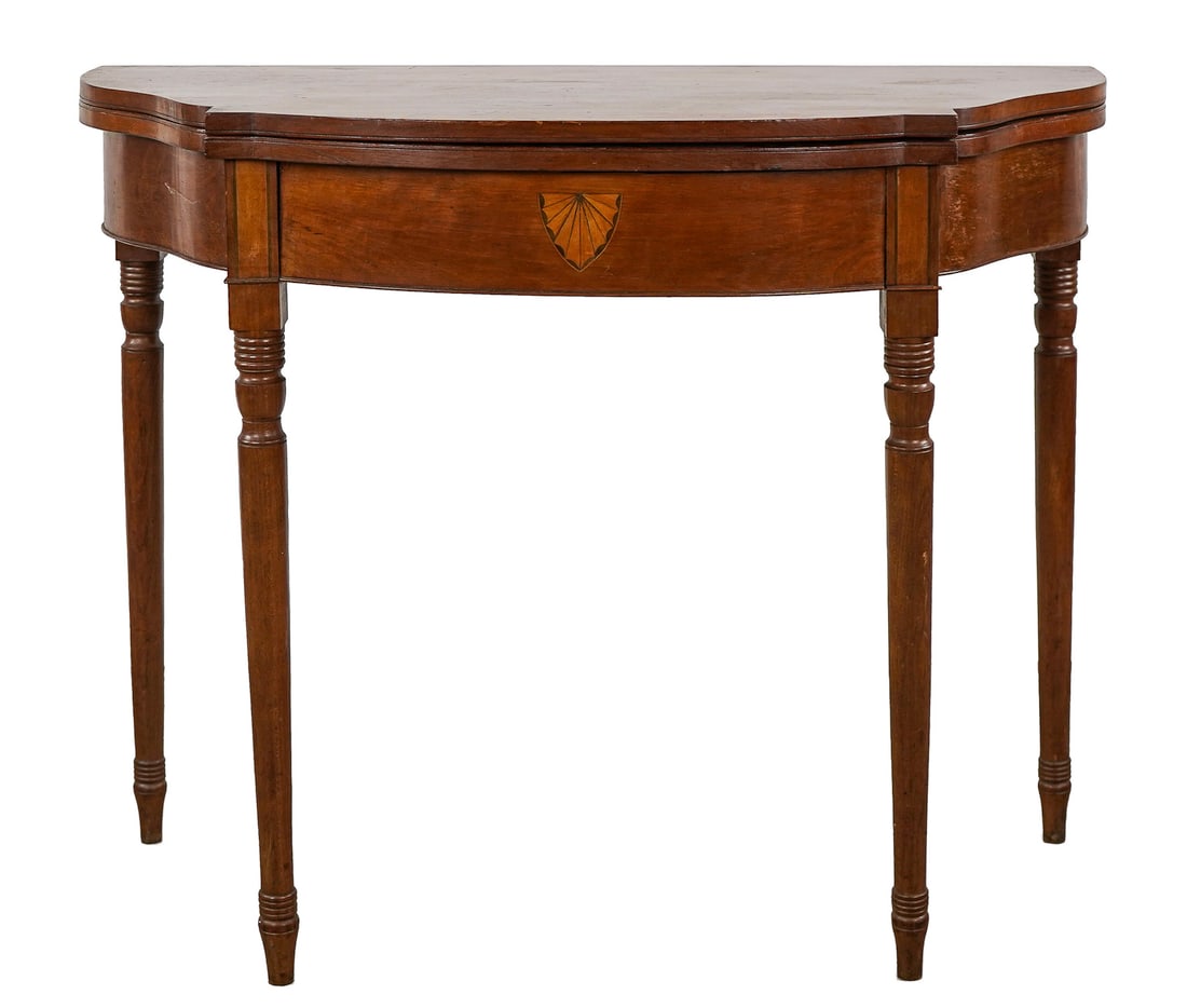 Vermont Sheraton Cherry Card Table: VT ca. 1830 Sheraton cherry block bow front card table. Front panel inlaid with fan. Legs with paneling. Refinished, top warping, descending in an old Montpelier, Vermont family. 36" wide, 29" h.