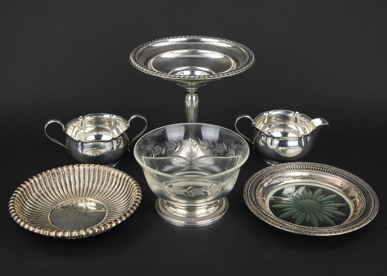 6 pcs. Assorted Sterling Silver Hollowware: Group of 6 pcs. of assorted sterling silver hollowware including Gorham sugar and creamer set, sterling base wheel etched divided dish, Gorham Leamington ribbed bowl, sterling banded bottle coaster, a