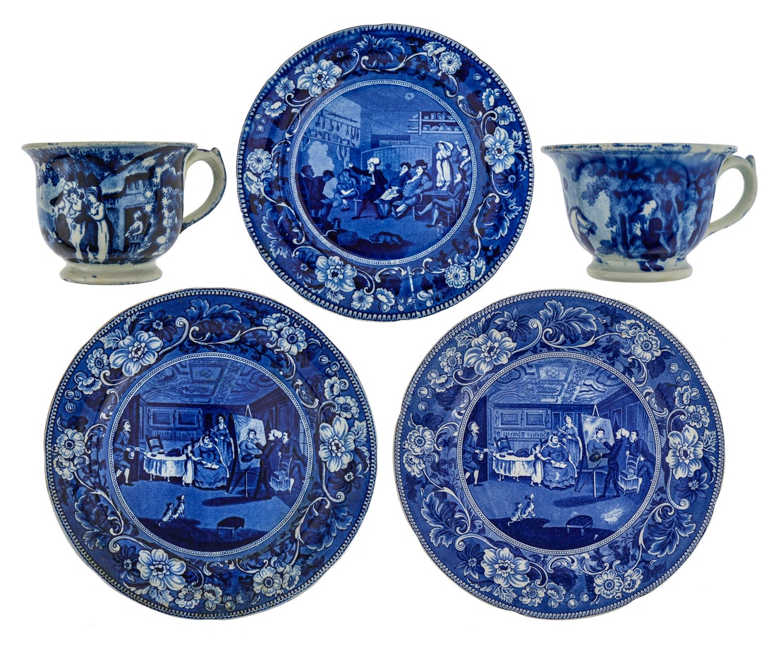 5 Deep Blue Staffordshire Doctor Syntax: 5 pieces of deep blue Staffordshire Doctor Syntax including two handled cups, 2 10" Clews plates Doctor Syntax painting a portrait, 8 7/8" plate Doctor Syntax Reading his tour. Each cup has a rim nick