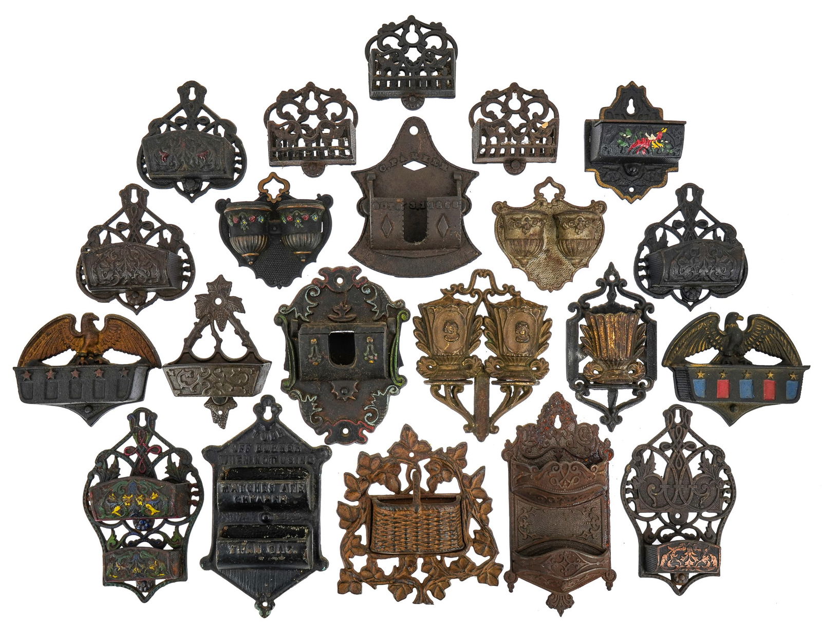 19th- 20th c Cast Iron Match Holders: 19th- 20th c cast iron match holders (21 pcs), including 1870 patent "C Parker" (5 1/2"), "Turn off burner when not using, matches are cheaper than gas" (7 1/2"), basket with vines, etc