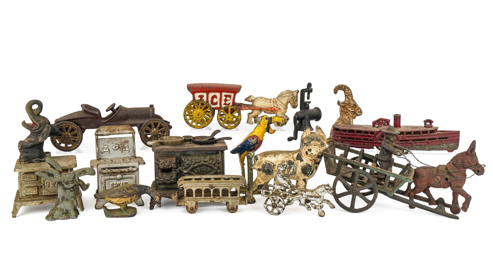19th- 20th c Cast Iron Toys, Bottle Openers: 19th- 20th c cast iron toys, bottle openers (15 pcs), including 3 pc donkey cart, early race car, sidewheeler, small horse & sulky, donkey and elephant bottle openers, etc, hts/ lengths 3 1/2" to 9"