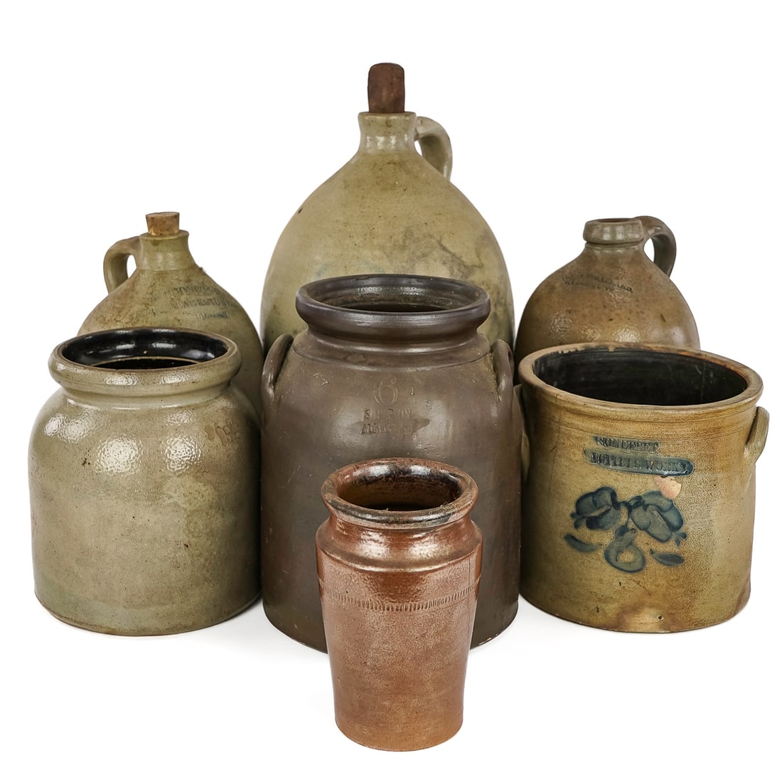19th c Stoneware Crocks & Jugs: 19th c stoneware crocks & jugs including W H Jones & Co,153 Blackstone St, Boston 1 gallon jug,Ol & AK Ballard, Burlington 1 gallon jug, 1 gallon jug with blue 3, S P & Son Albany 6 qt Albany slip gla