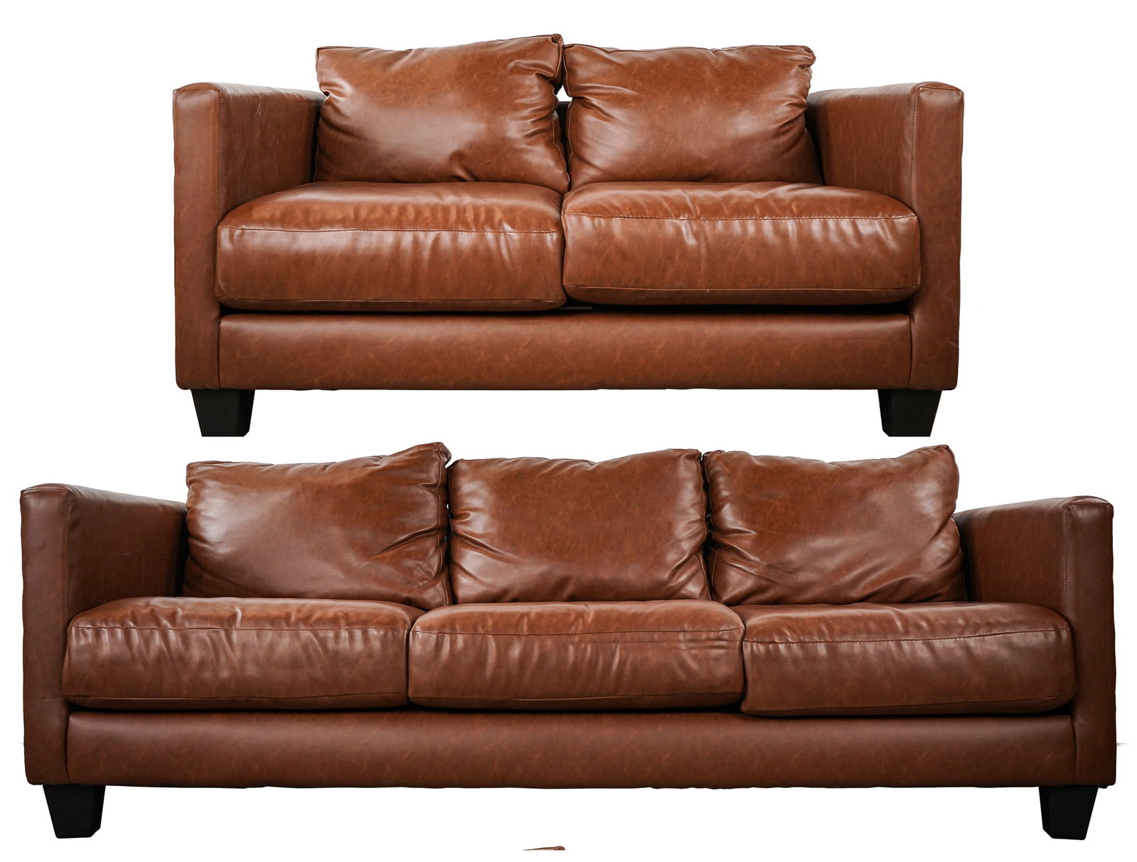 2 Piece Modern Leatherette Sofa Set: 2 piece modern brown leatherette Naugahyde sofa set from Carolina Girl Furniture including a 3 cushion sofa 7'long, 36"deep, 27"h. With a 2 cushion settee 5' long, 27"h, 36" deep. Good condition.