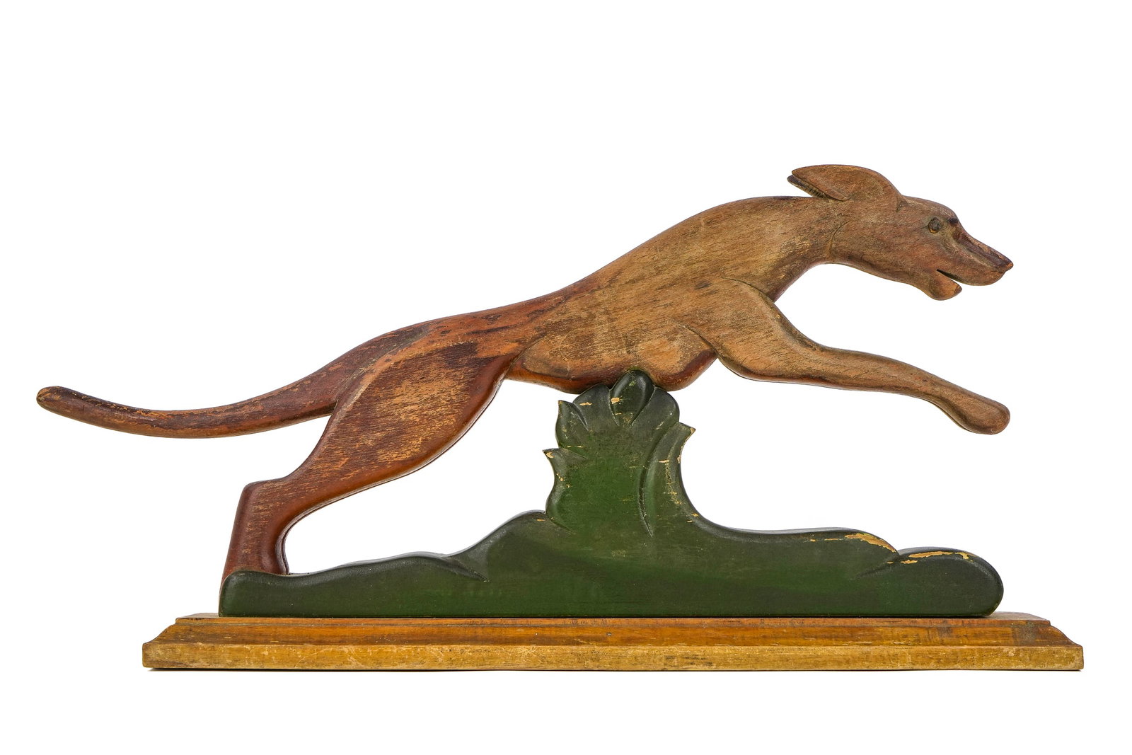 Folk Art Carving of Leaping Running Dog: Early 20th c Folk Art carving of a running dog leaping over bush. Paint decorated and in good condition.