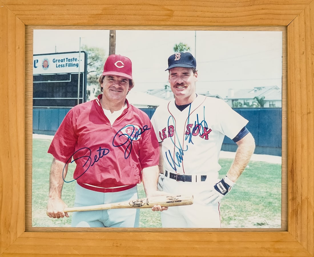 Framed Photo of Wade Boggs & Pete Rose Autographed: 1980's color photograph of Wade Boggs & Pete Rose autographed by each. 11" x 13" outside frame.