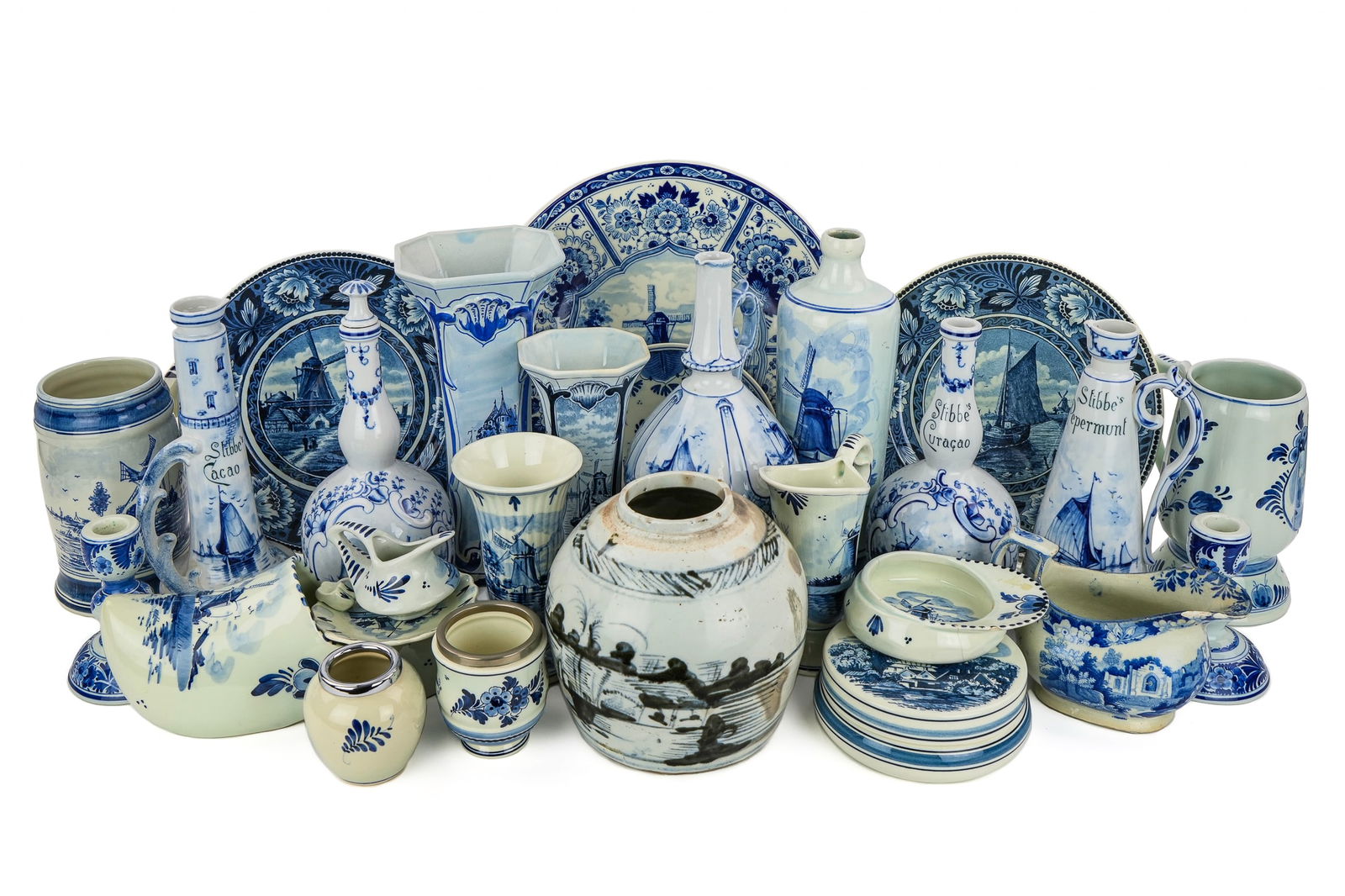 Collection of Delft and Blue Decorated Porcelain: Collection of Dutch Delft and other blue and white decorated porcelain including vases, liquor decanters and ewers, , mugs, candlesticks, early 19th c. Staffordshire creamer, Chinese Canton blue and w