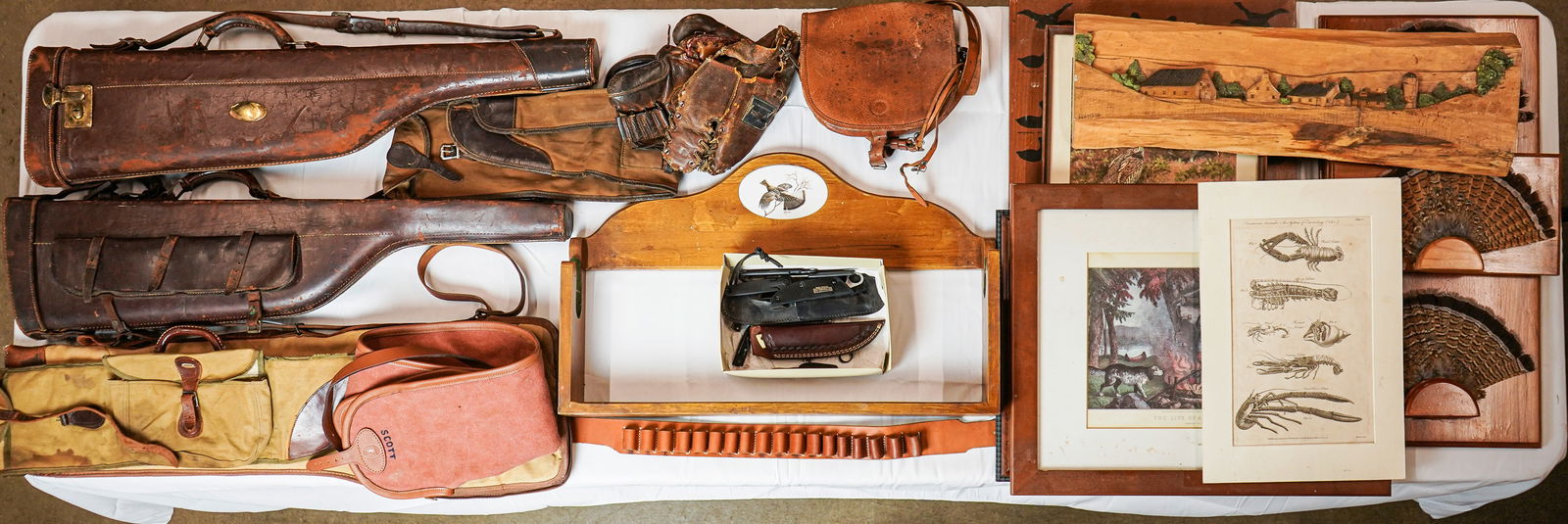 Early Leather Gun Cases Knives & Sporting Art: Sporting lot including 2 early leather take down gun cases. Canvas gun sleeves. Various odd knives. Sporting art including a P B Schad sporting bird stenciled mirror. David Maass gun rack with porcela